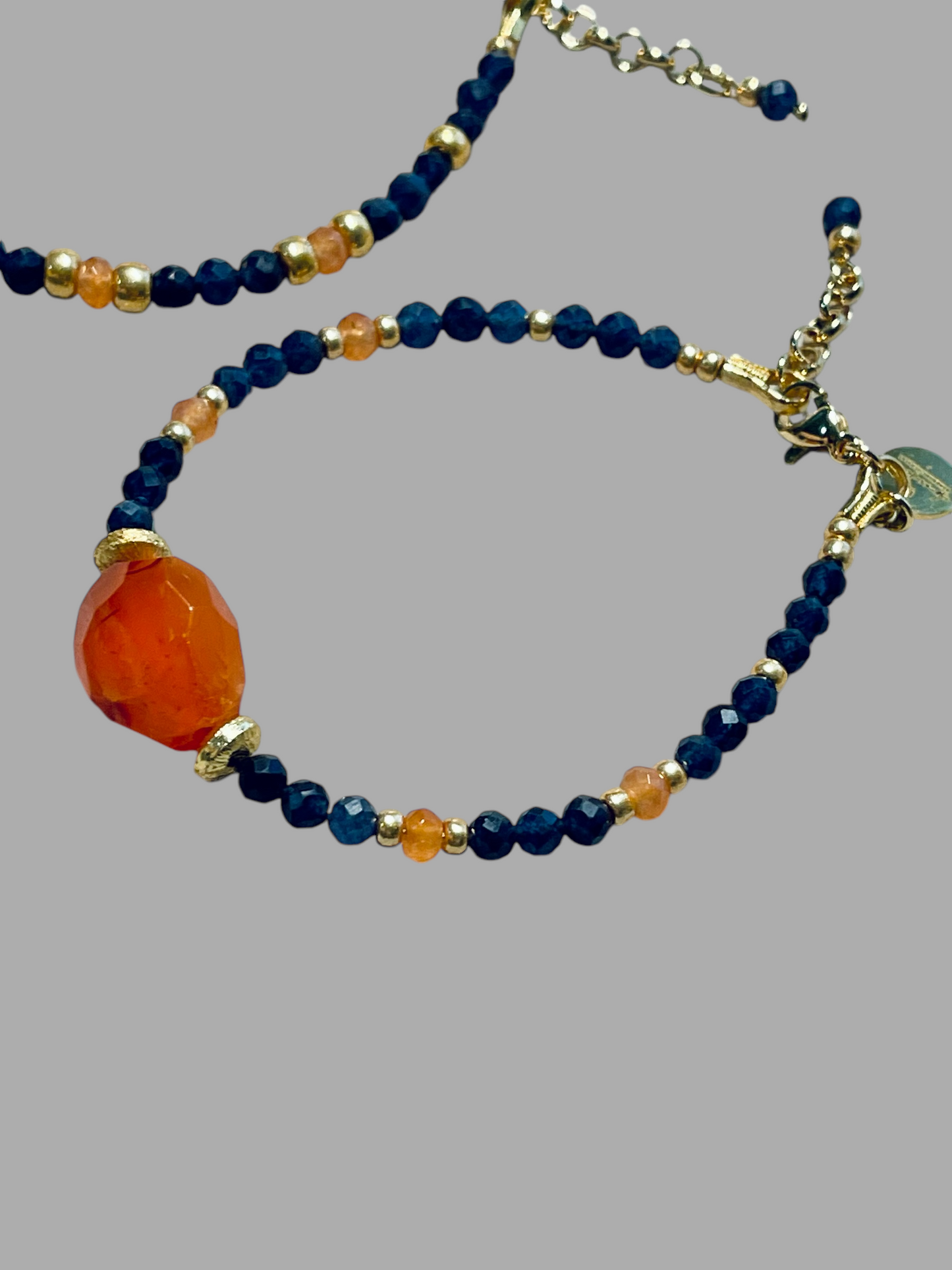 Fire & Twilight Bracelet~ Very Limited Edition: Faceted Sapphire beads Gold accent beads and a faceted Carnelian Centerpiece