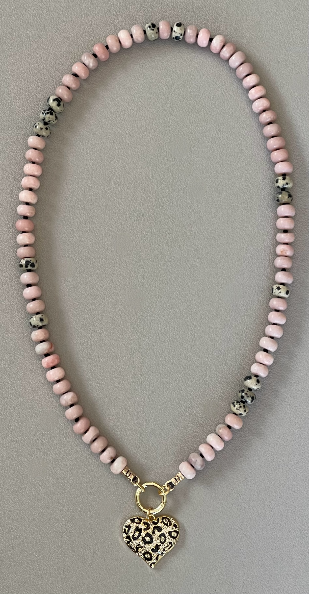 The Pink Leopard Necklace: Natural matte pink opals hand knotted on black silk w Dalmatian Jasper accents Gold pavé leopard heart OOAK