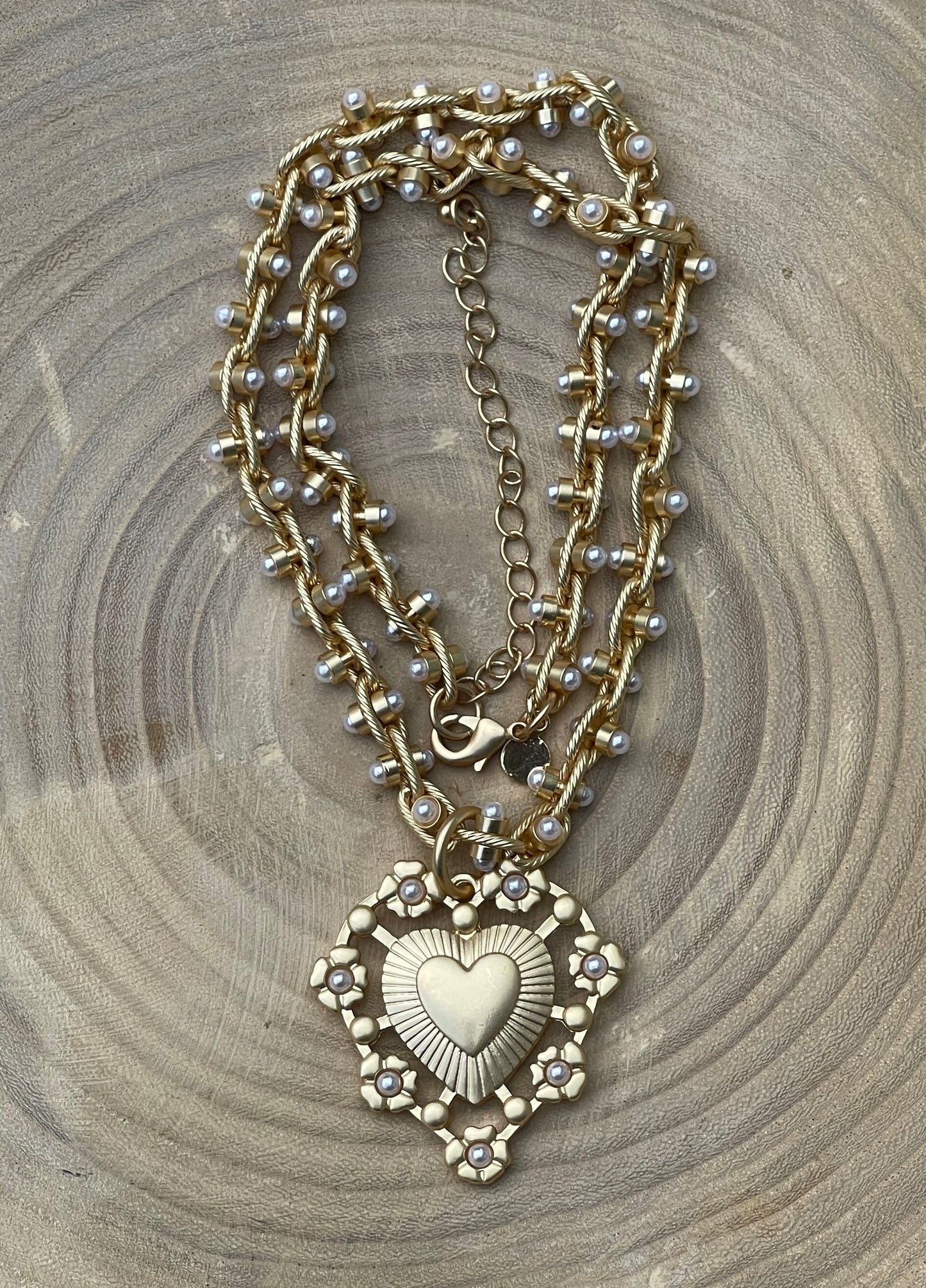 Bold Bijoux in Gold Necklace: Matte gold throughout Tiny pearls Statement heart