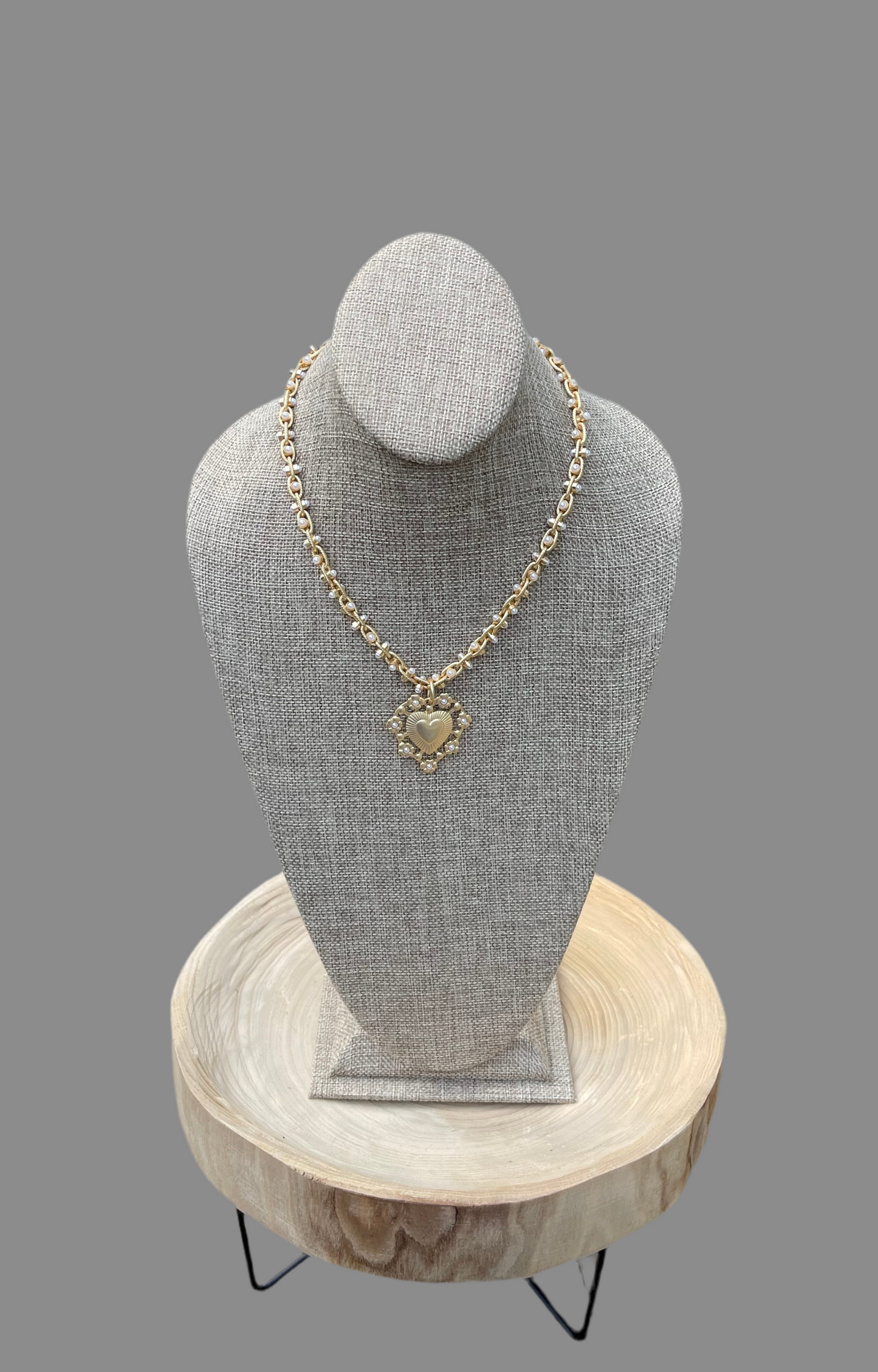 Bold Bijoux in Gold Necklace: Matte gold throughout Tiny pearls Statement heart