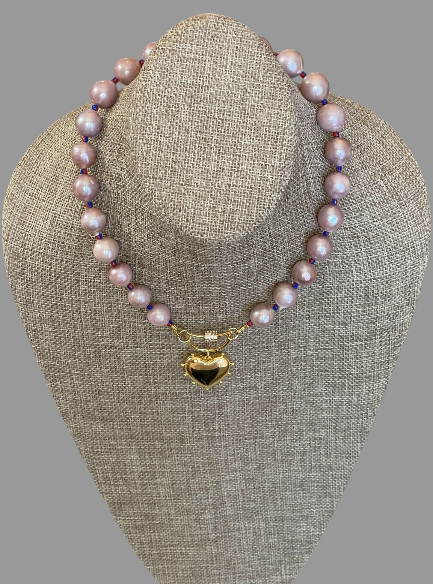 The Yves Necklace: Lavender Edison Pearls w/glass spacers, a gold crescent clasp holding a heart pendant OOAK