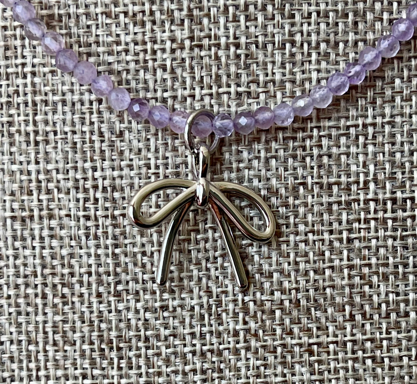 The Amethyst Skinny: Faceted Amethyst gemstones with a bow charm in Gold or Silver