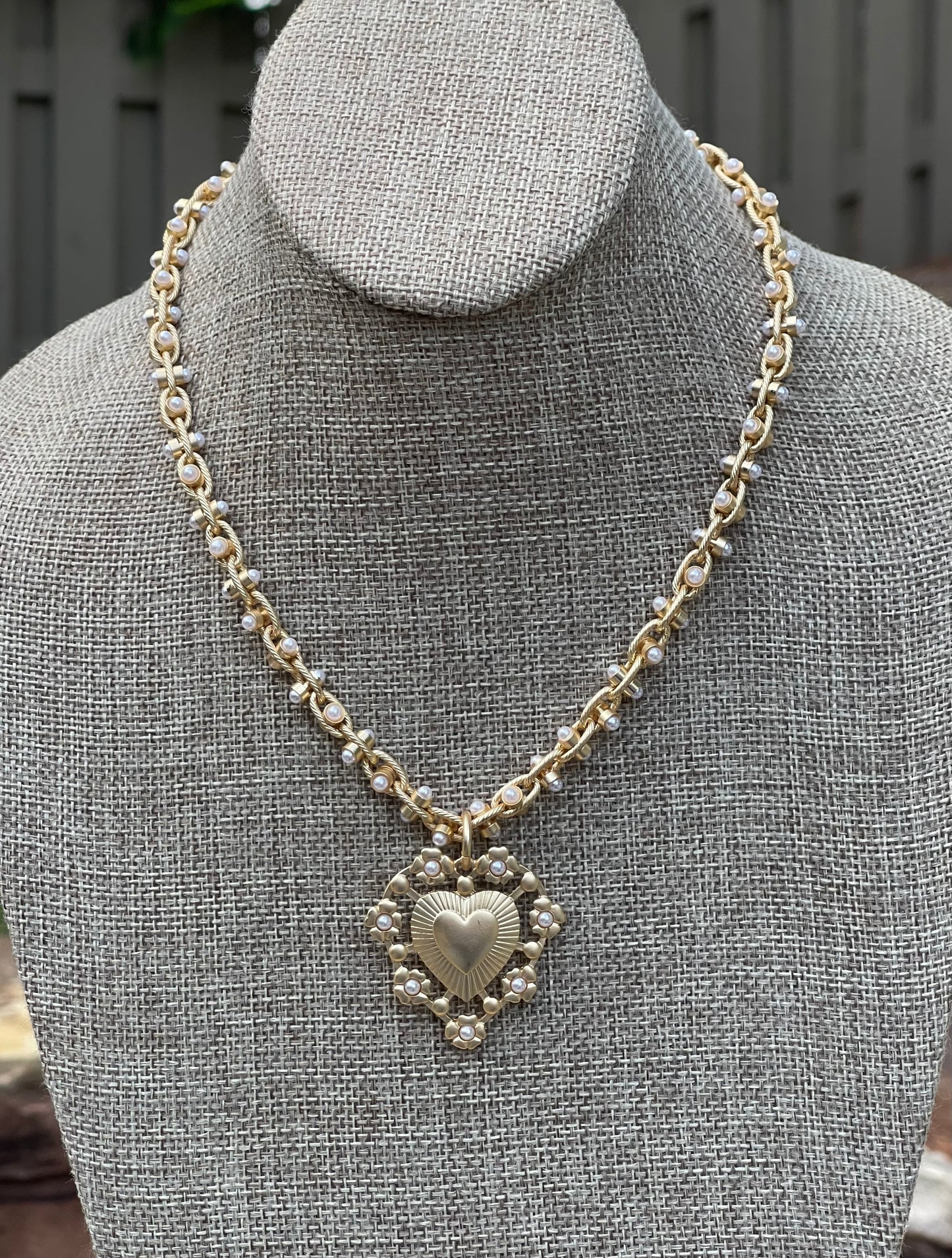 Bold Bijoux in Gold Necklace: Matte gold throughout Tiny pearls Statement heart