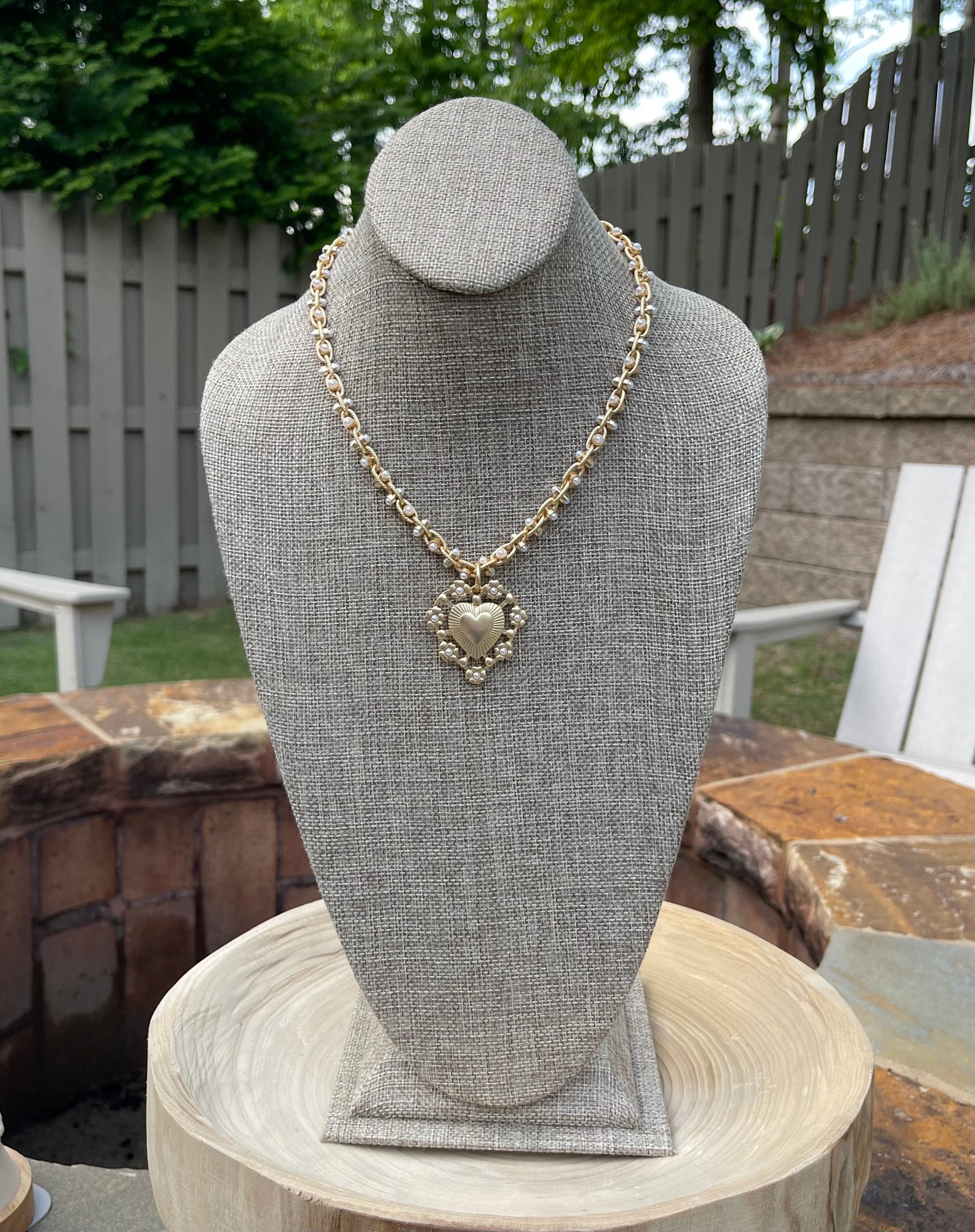Bold Bijoux in Gold Necklace: Matte gold throughout Tiny pearls Statement heart