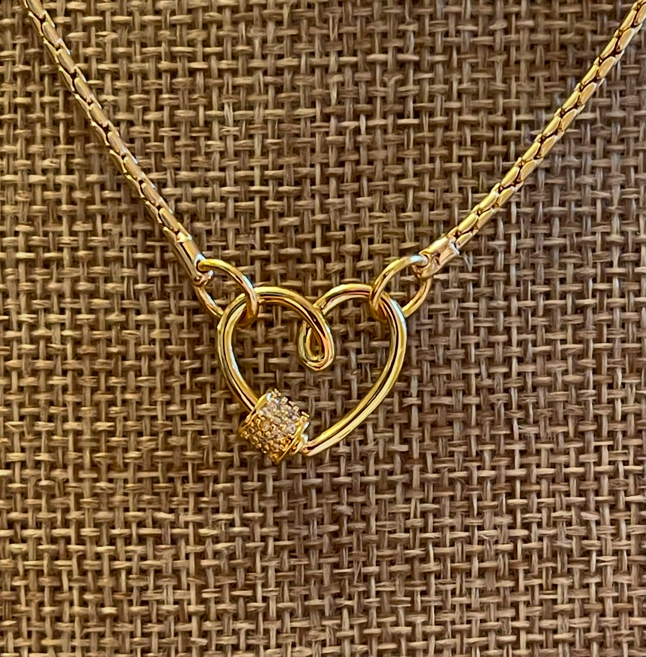 Be Still My Heart Necklace: A thin gold cable chain w/ an adorable heart that doubles as a clasp and a charm holder Pavé screw closure OOAK