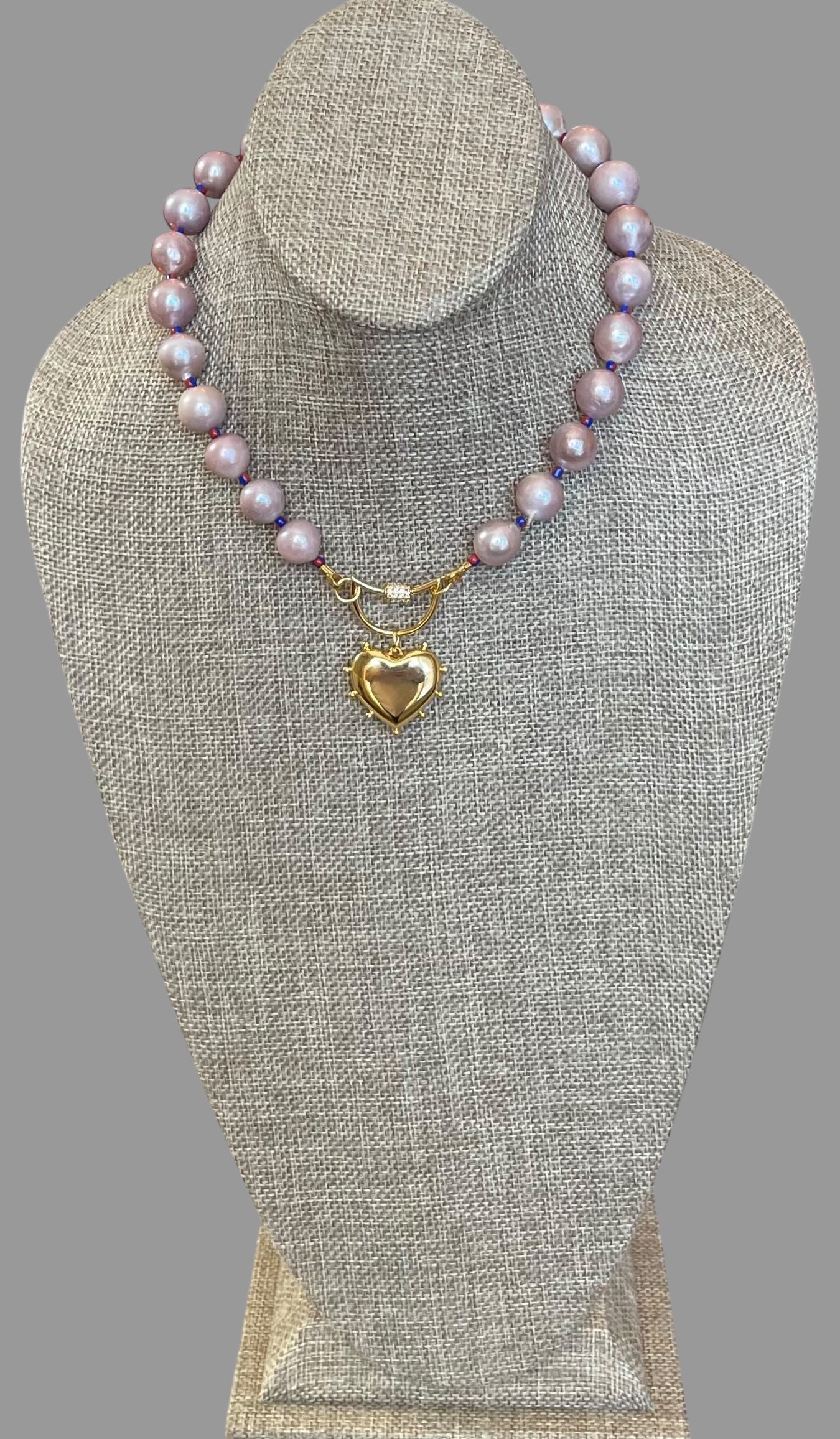 The Yves Necklace: Lavender Edison Pearls w/glass spacers, a gold crescent clasp holding a heart pendant OOAK