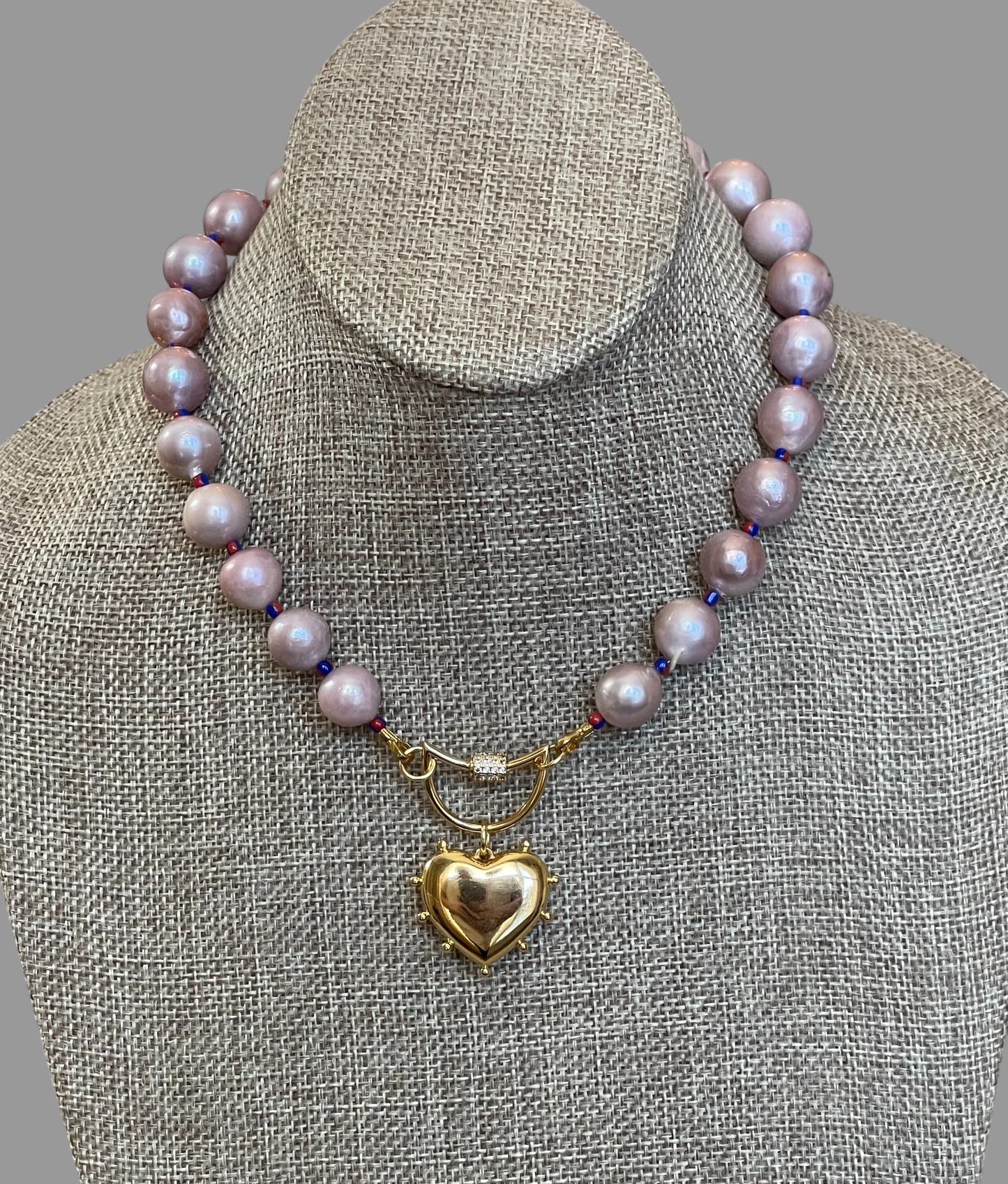 The Yves Necklace: Lavender Edison Pearls w/glass spacers, a gold crescent clasp holding a heart pendant OOAK