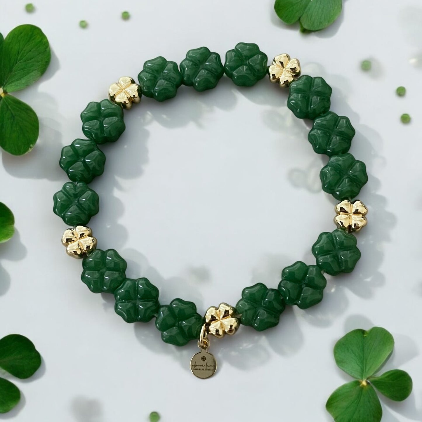 Green Glass and Gold Shamrock bracelet: A stretch bracelet made with glass carved beads and gold filled brass accent beads FREE SHIPPING!