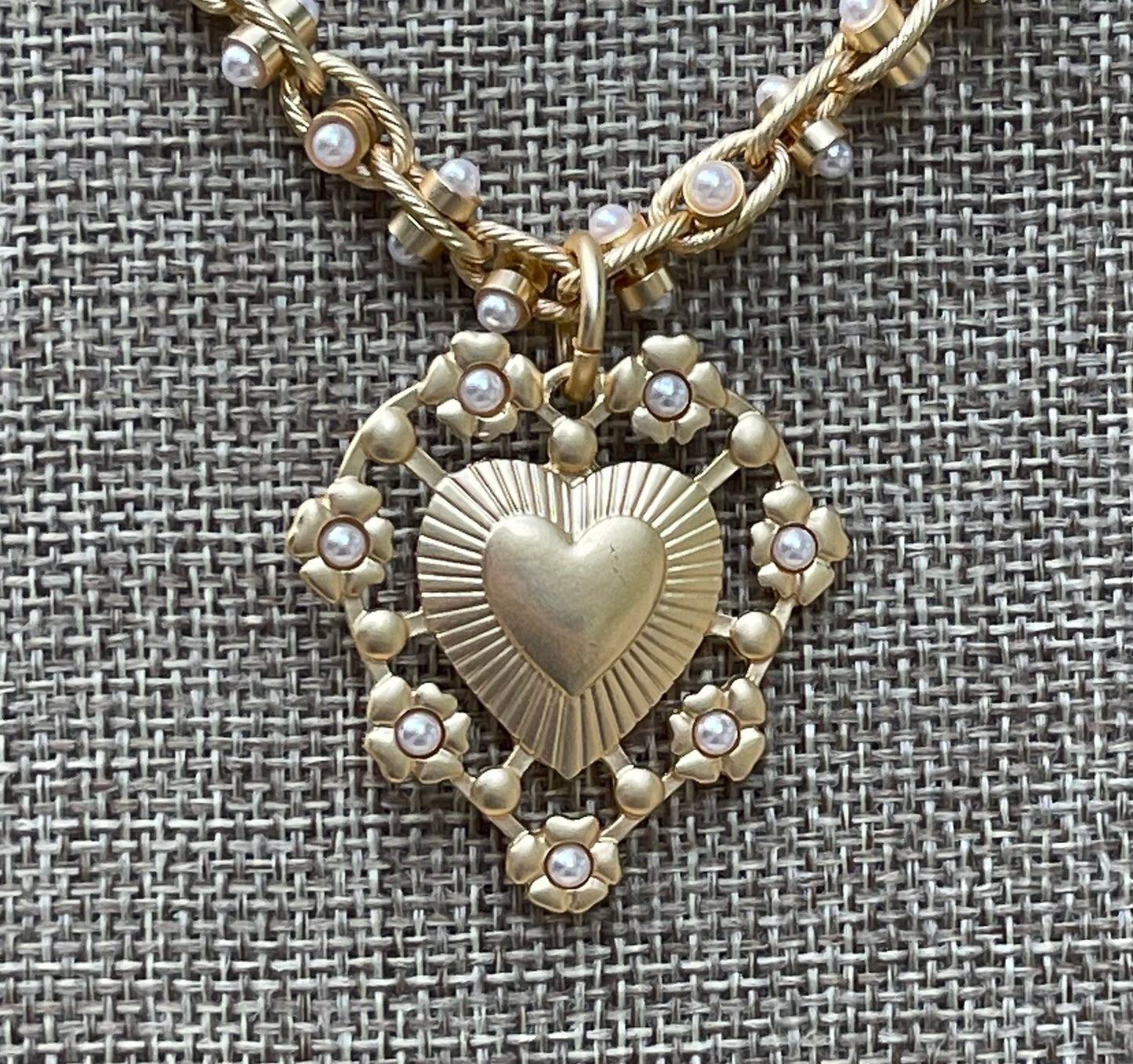 Bold Bijoux in Gold Necklace: Matte gold throughout Tiny pearls Statement heart