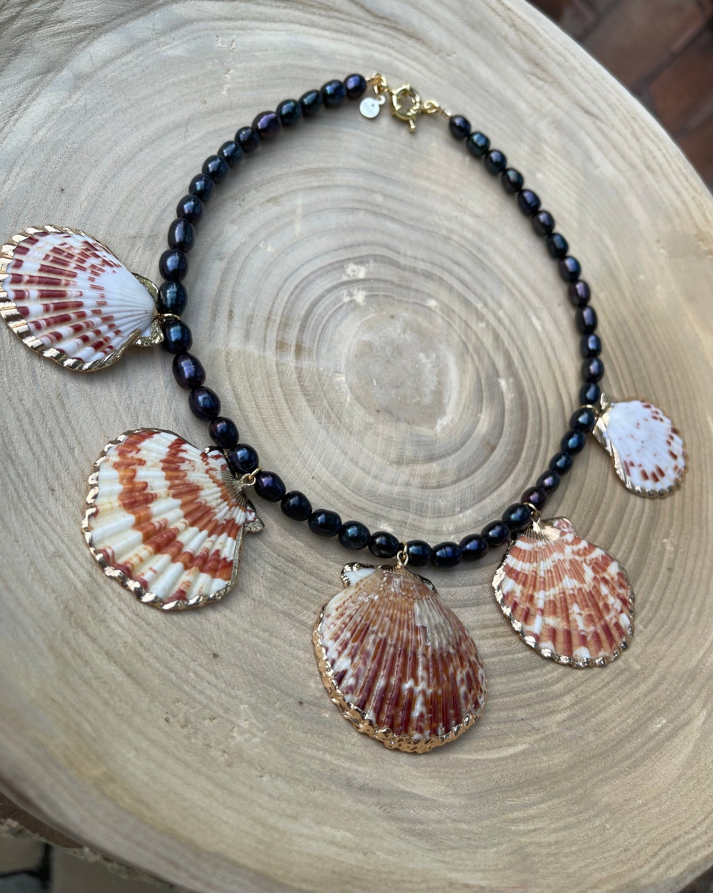 Midnight on the Beach Necklace: Midnight blue freshwater pearls with natural Lions Paw seashell pendants