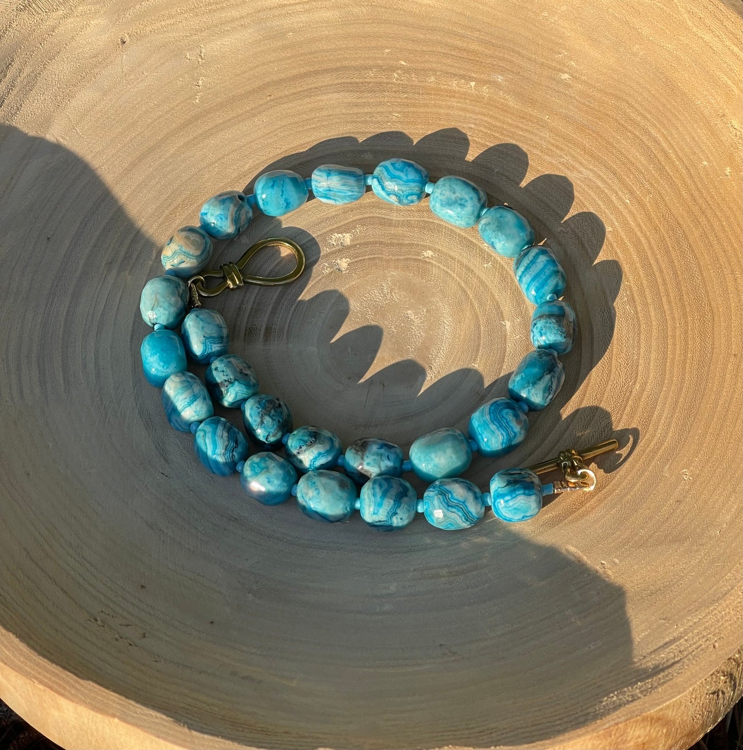 Cerulean Lace Necklace: Faceted Crazy Lace Agate with a deep gold luxe toggle clasp