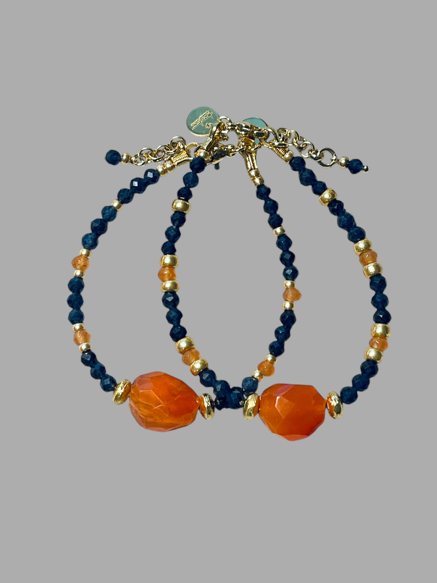 Fire & Twilight Bracelet~ Very Limited Edition: Faceted Sapphire beads Gold accent beads and a faceted Carnelian Centerpiece