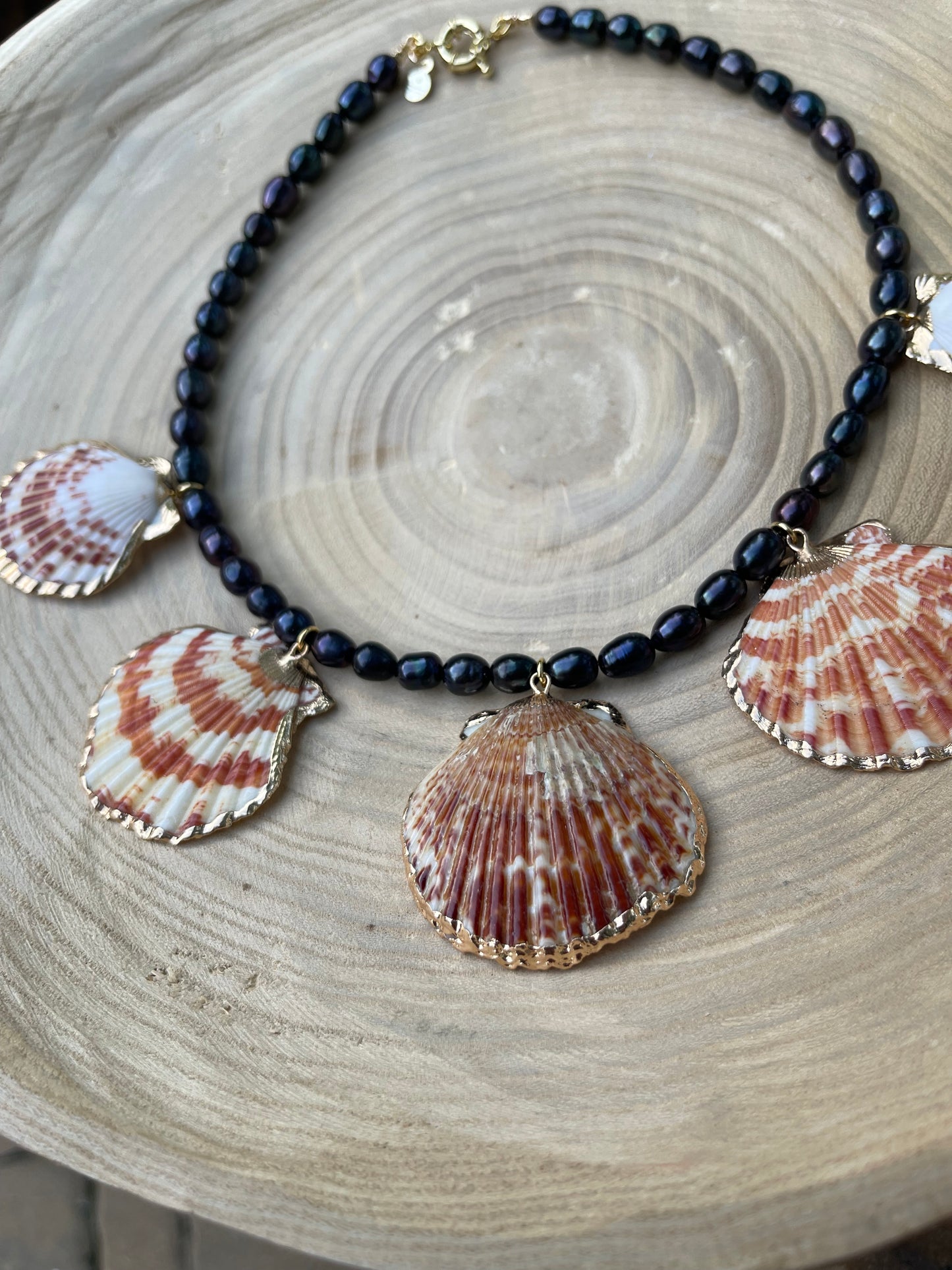 Midnight on the Beach Necklace: Midnight blue freshwater pearls with natural Lions Paw seashell pendants