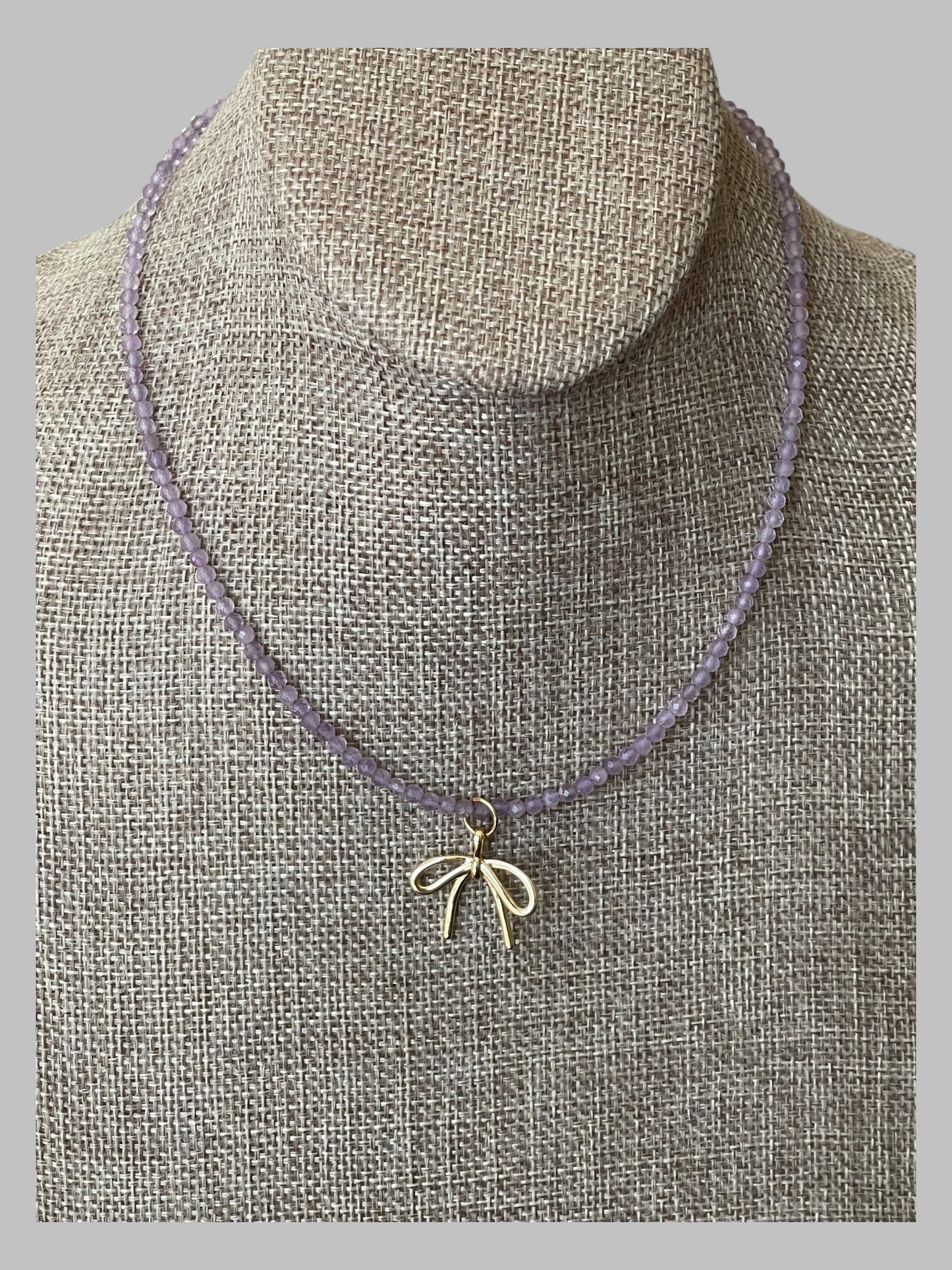 The Amethyst Skinny: Faceted Amethyst gemstones with a bow charm in Gold or Silver