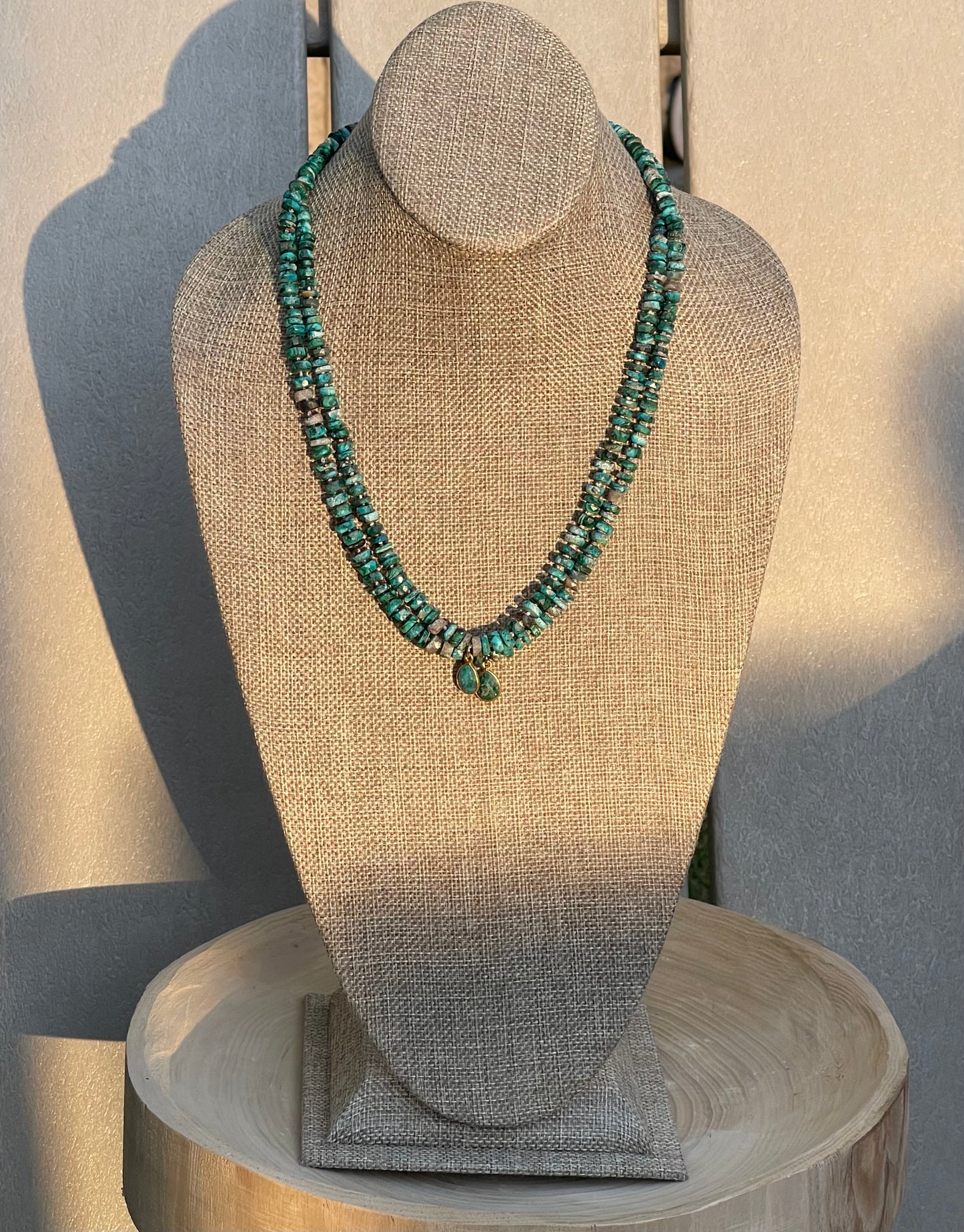 Tibetan Tides Necklace: Faceted Tibetan Turquoise Handknotted on silk with an Emerald teardrop pendant