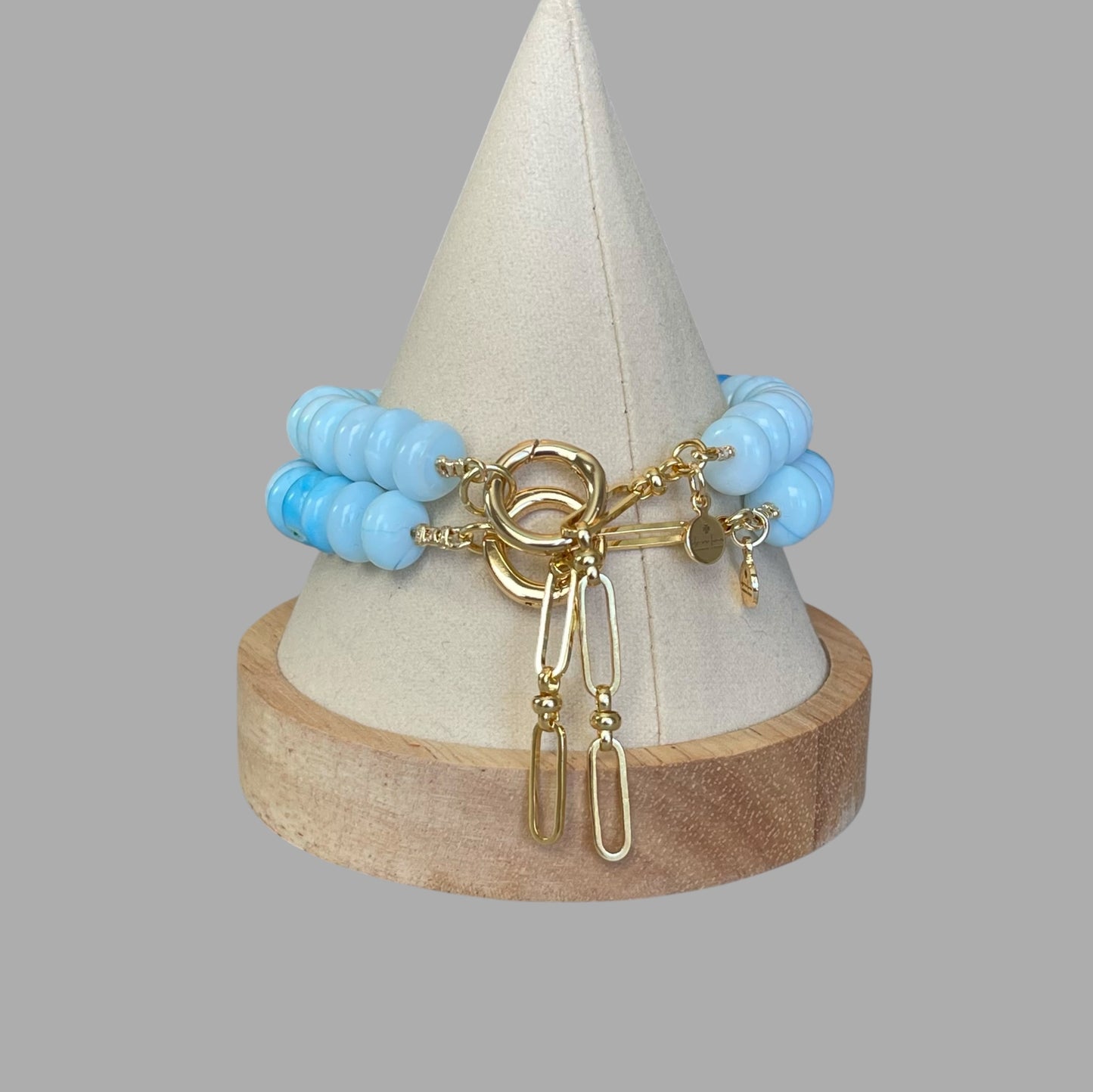 Robin’s Egg Opal Bracelet: Robin’s egg blue Opals with a Baroque Pearl center Gold clasp
