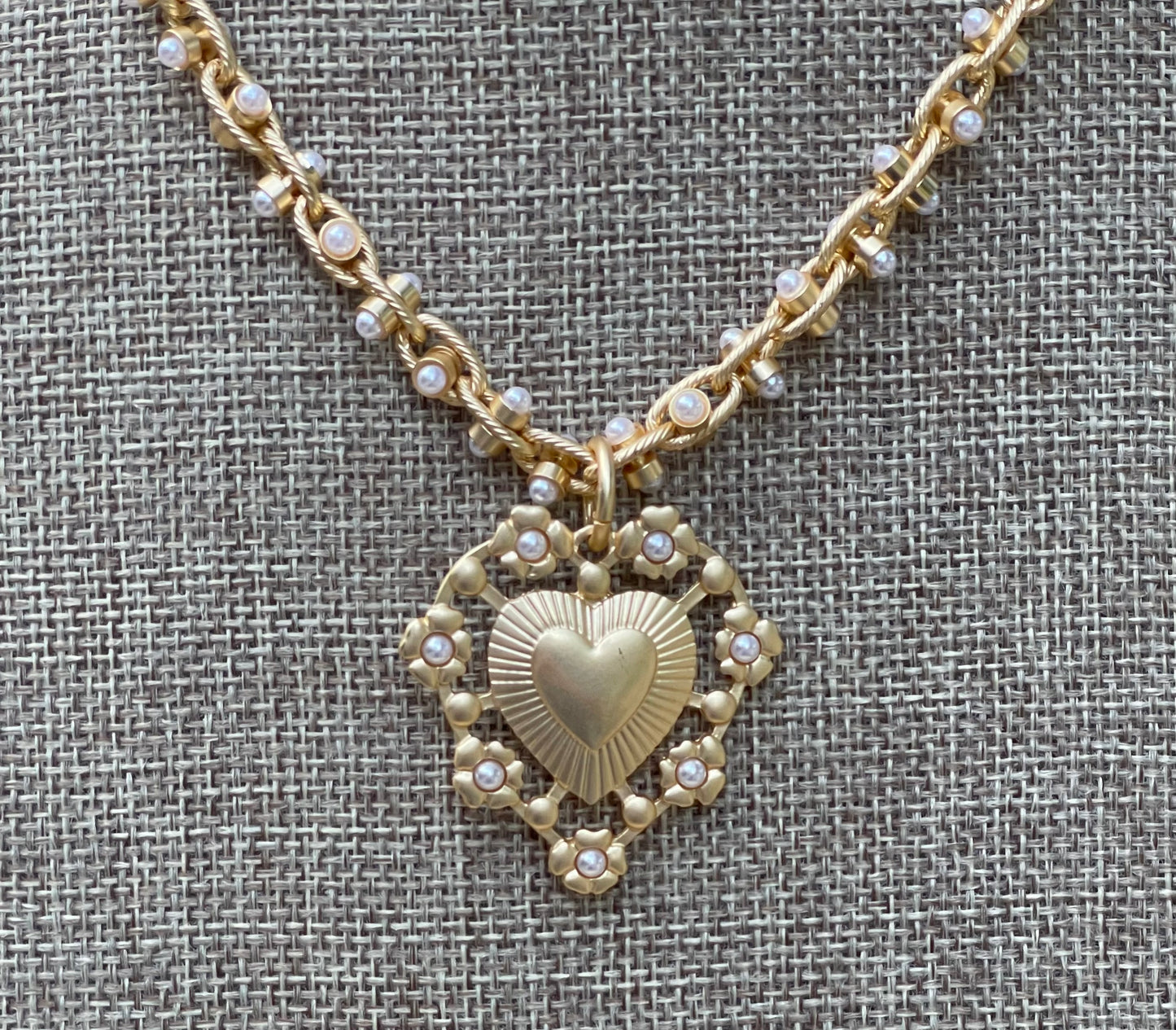 Bold Bijoux in Gold Necklace: Matte gold throughout Tiny pearls Statement heart