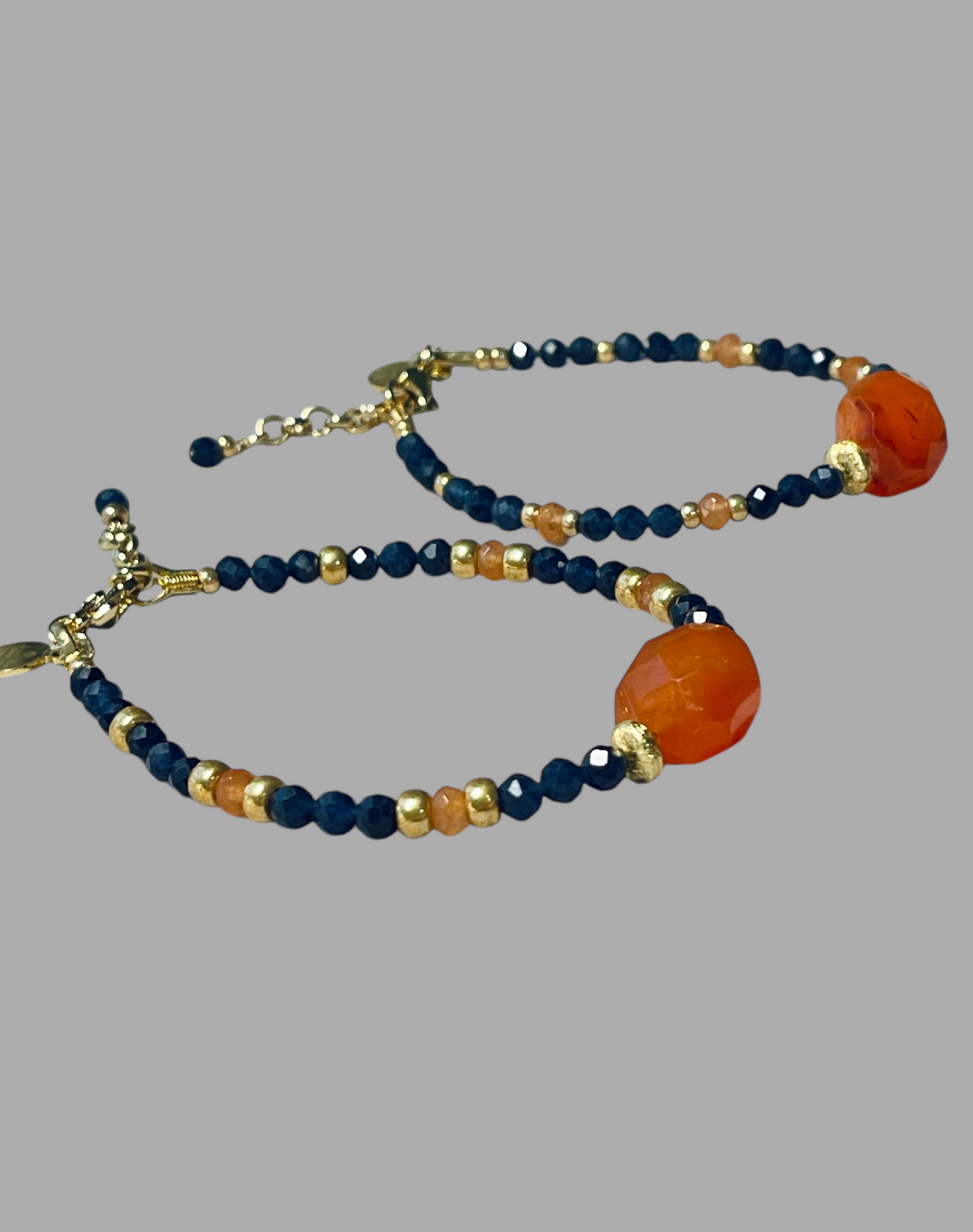 Fire & Twilight Bracelet~ Very Limited Edition: Faceted Sapphire beads Gold accent beads and a faceted Carnelian Centerpiece