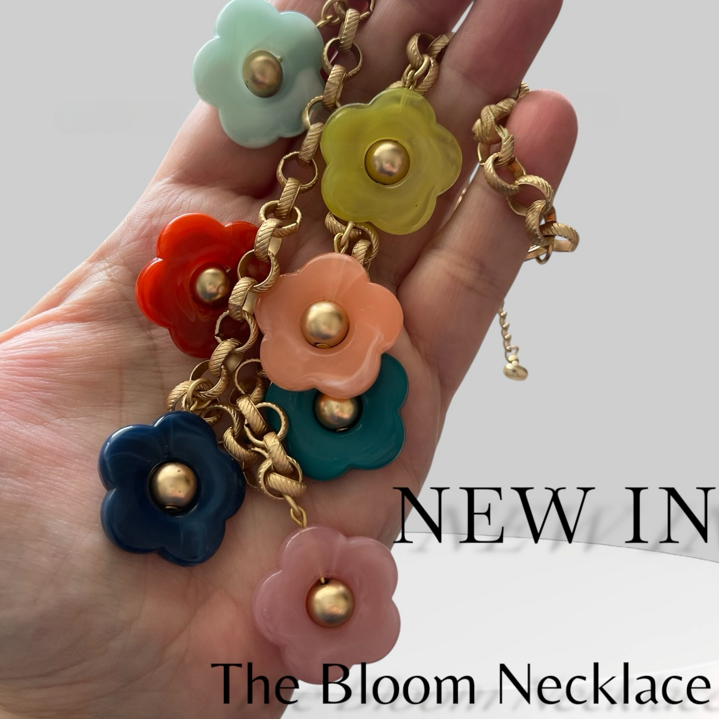 Bloom Necklace: Acrylic flowers with brushed gold centers on a brushed gold Rolo chain