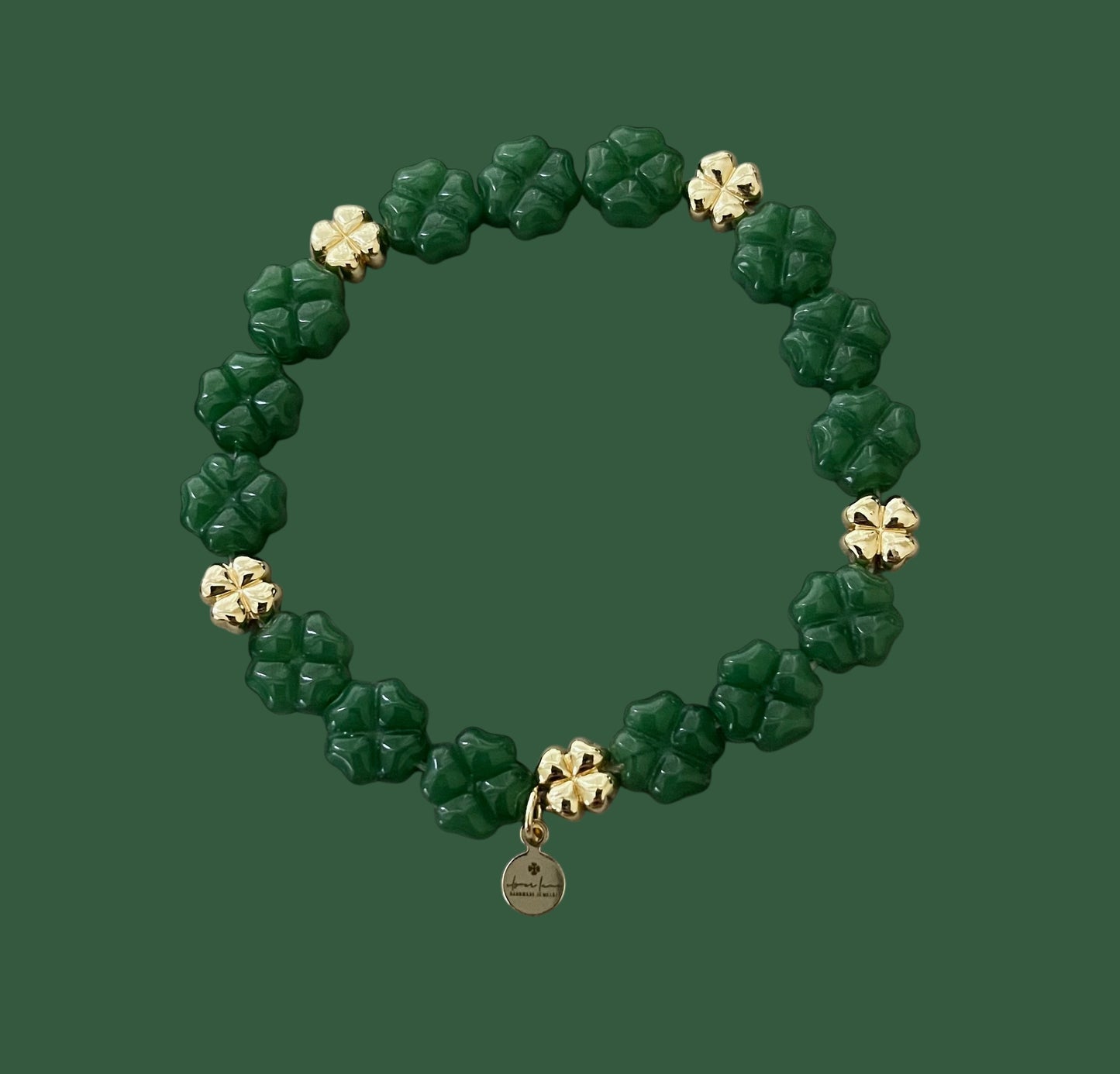 Green Glass and Gold Shamrock bracelet: A stretch bracelet made with glass carved beads and gold filled brass accent beads FREE SHIPPING!