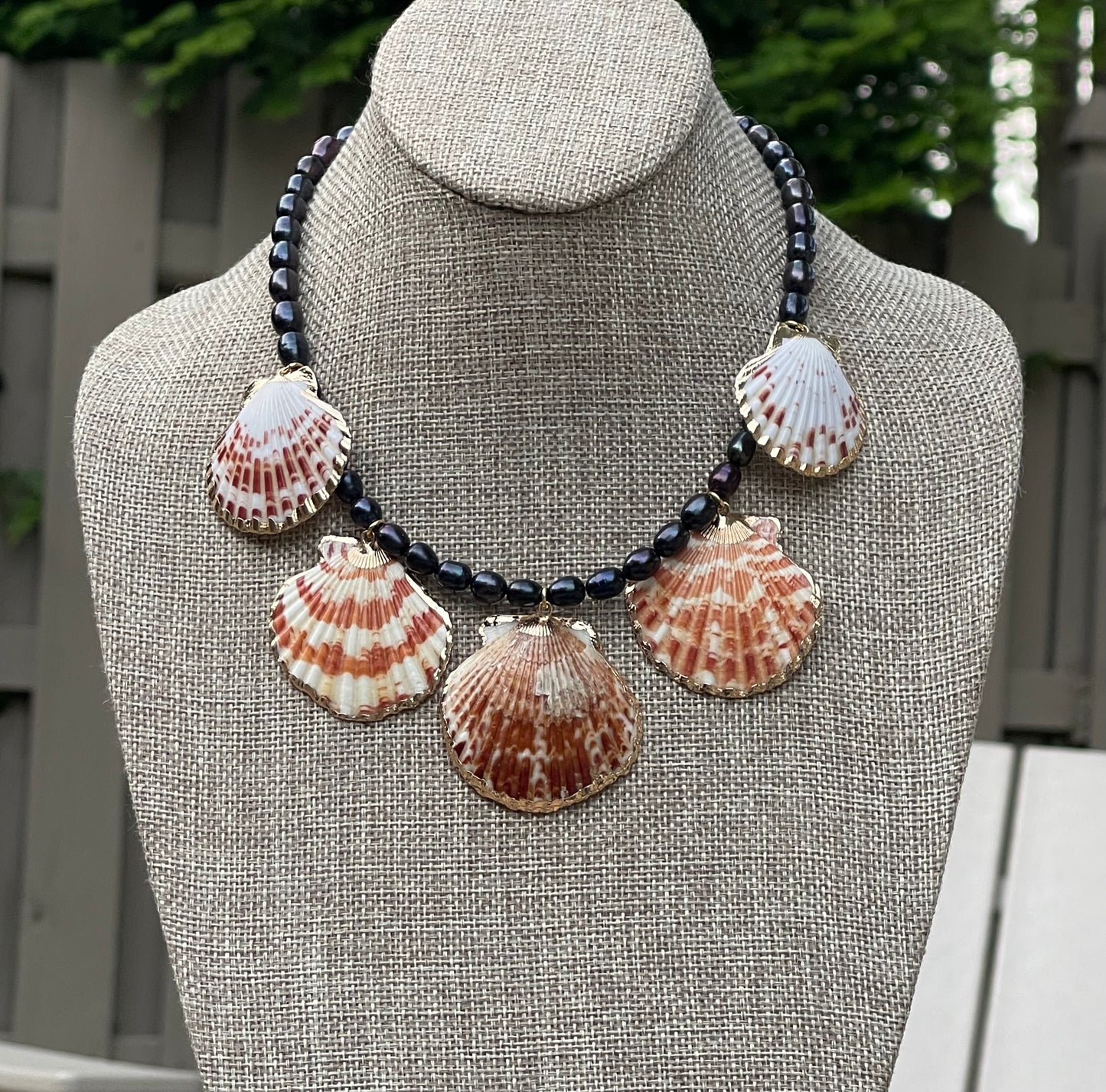 Midnight on the Beach Necklace: Midnight blue freshwater pearls with natural Lions Paw seashell pendants