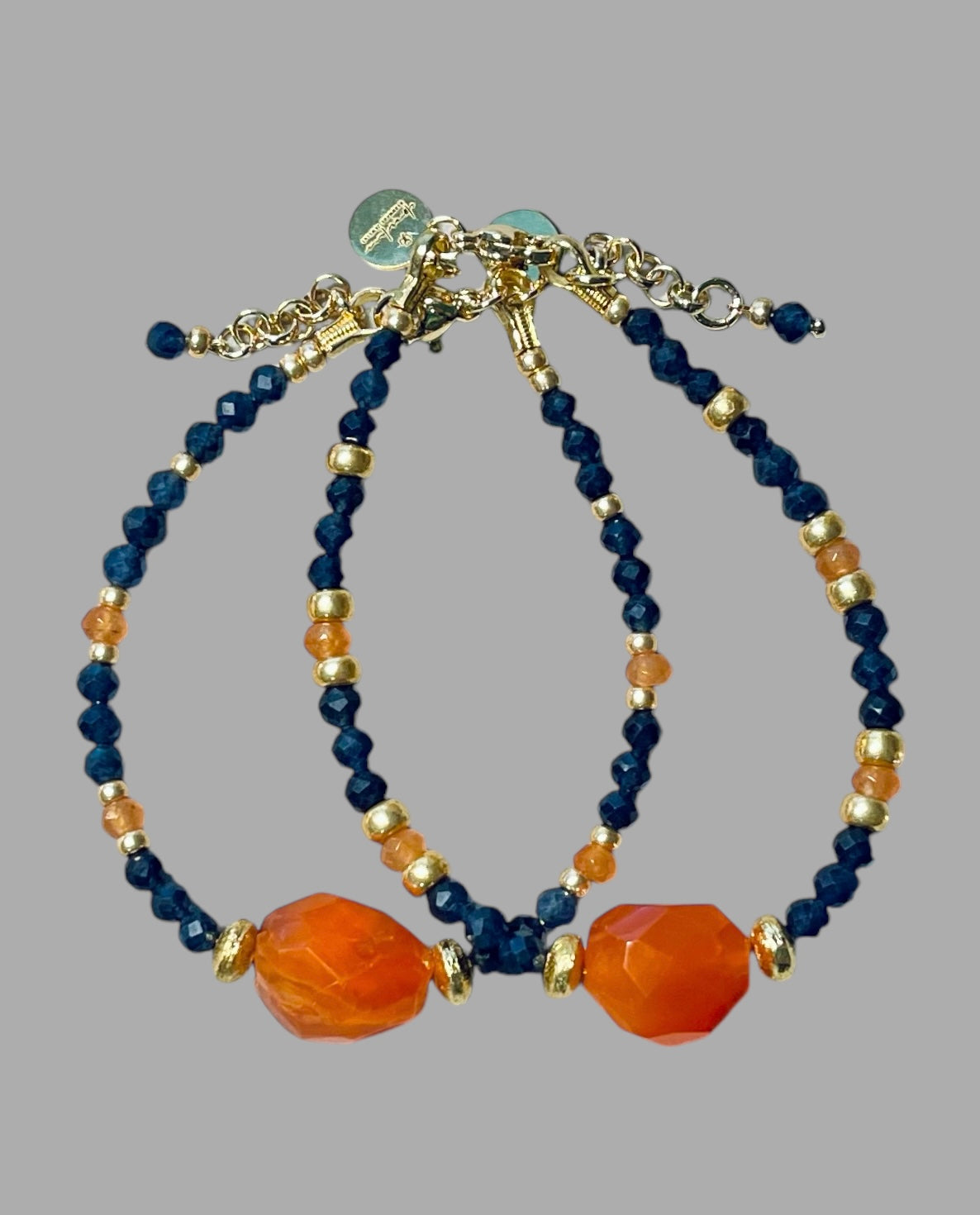 Fire & Twilight Bracelet~ Very Limited Edition: Faceted Sapphire beads Gold accent beads and a faceted Carnelian Centerpiece