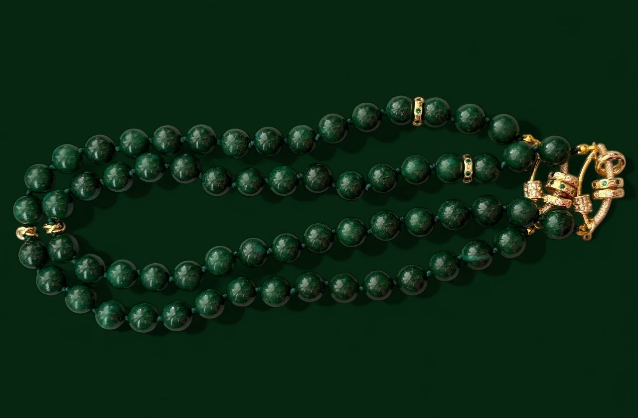 Vintage Vogue Necklace: Vintage Chinese Jade beads hand-knotted on matching satin cord•Gold pavé accents and charms