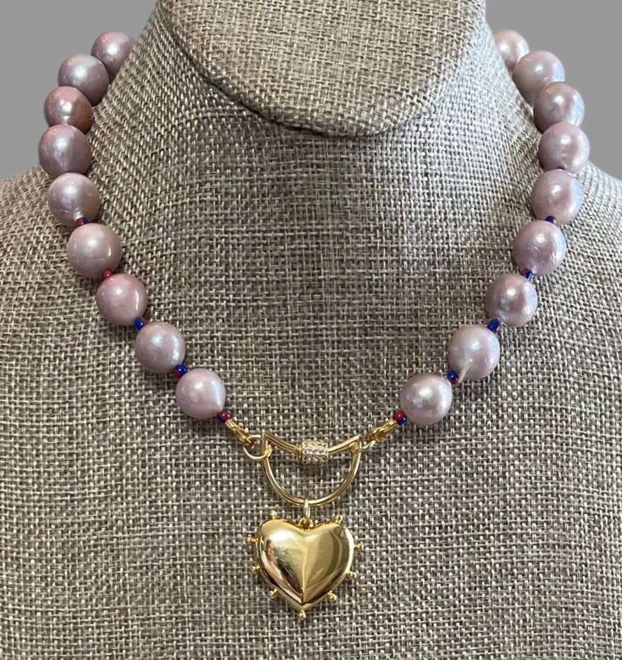 The Yves Necklace: Lavender Edison Pearls w/glass spacers, a gold crescent clasp holding a heart pendant OOAK