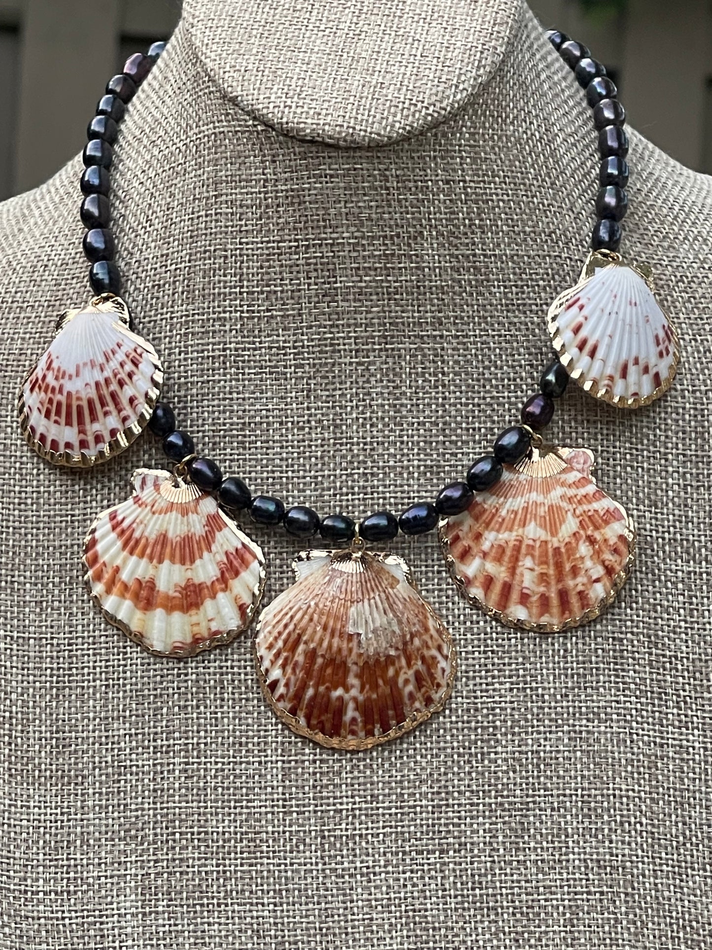 Midnight on the Beach Necklace: Midnight blue freshwater pearls with natural Lions Paw seashell pendants