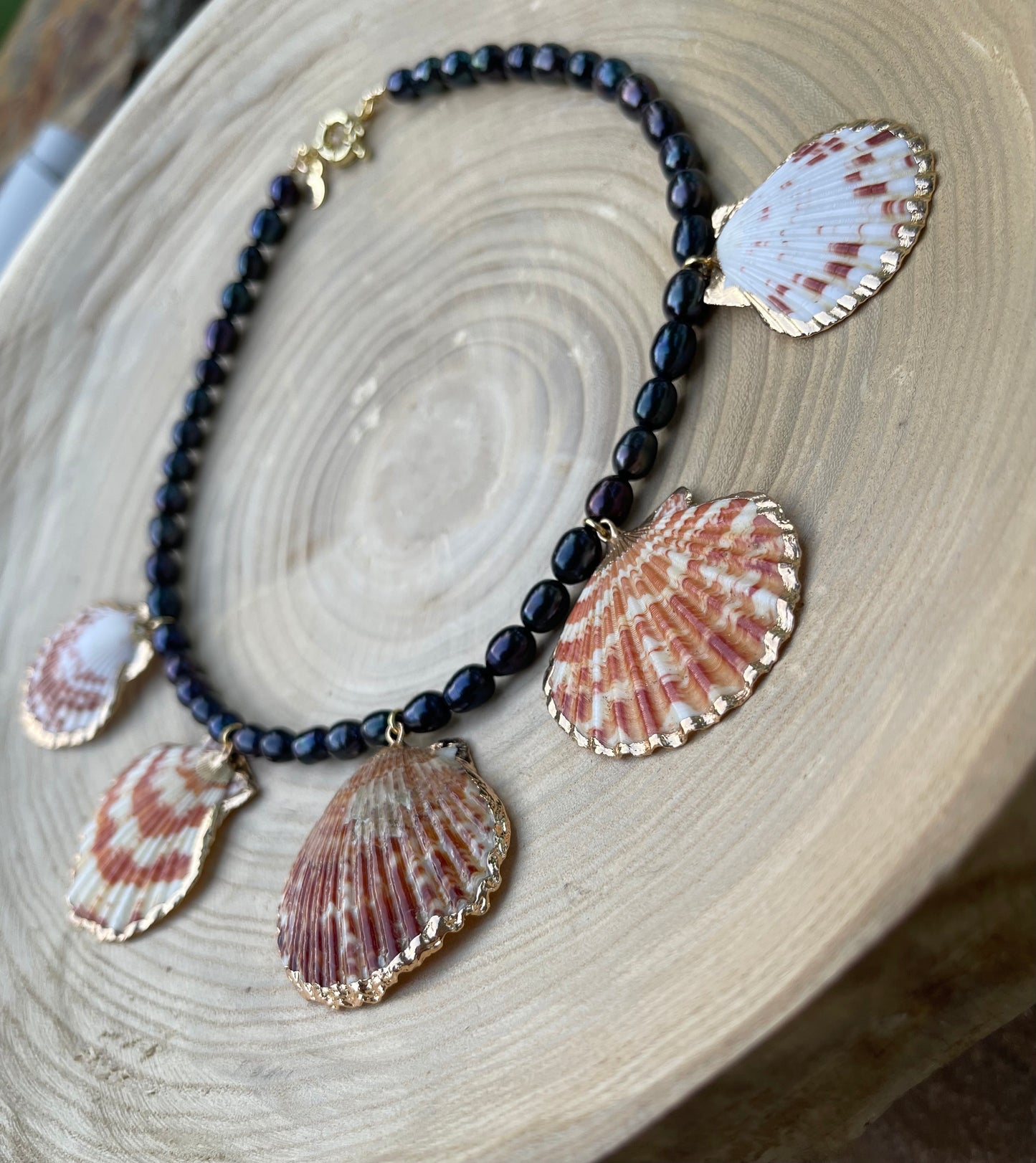 Midnight on the Beach Necklace: Midnight blue freshwater pearls with natural Lions Paw seashell pendants