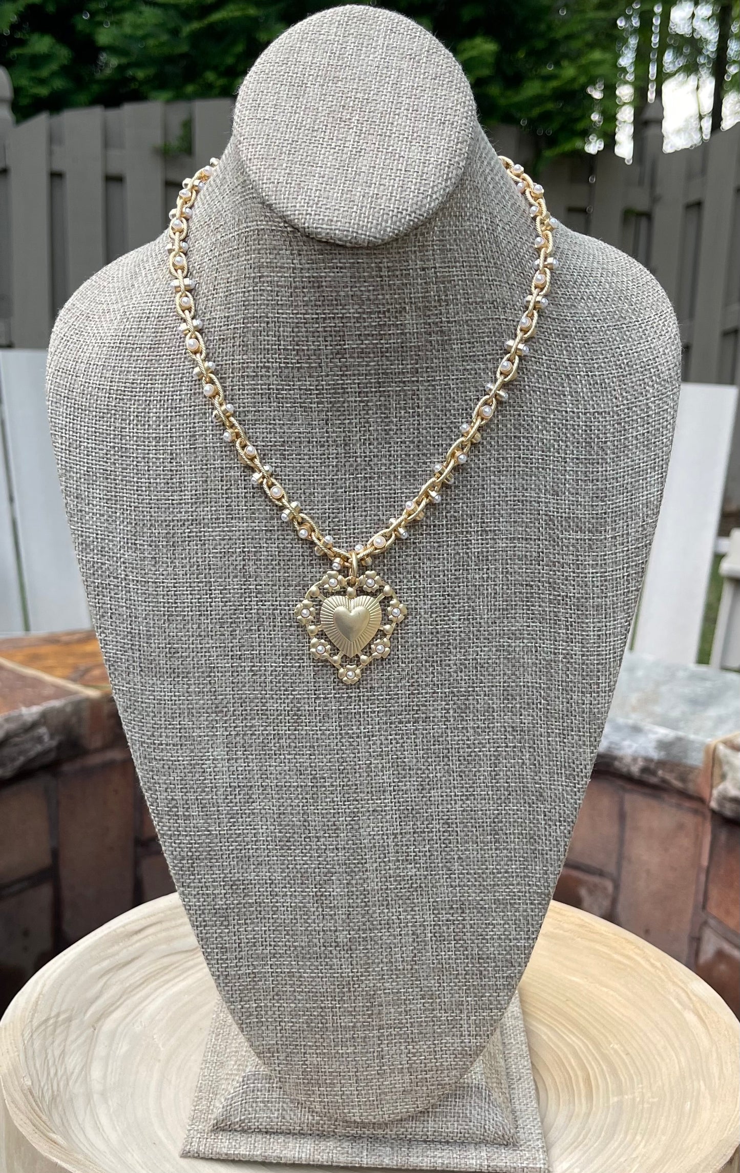 Bold Bijoux in Gold Necklace: Matte gold throughout Tiny pearls Statement heart
