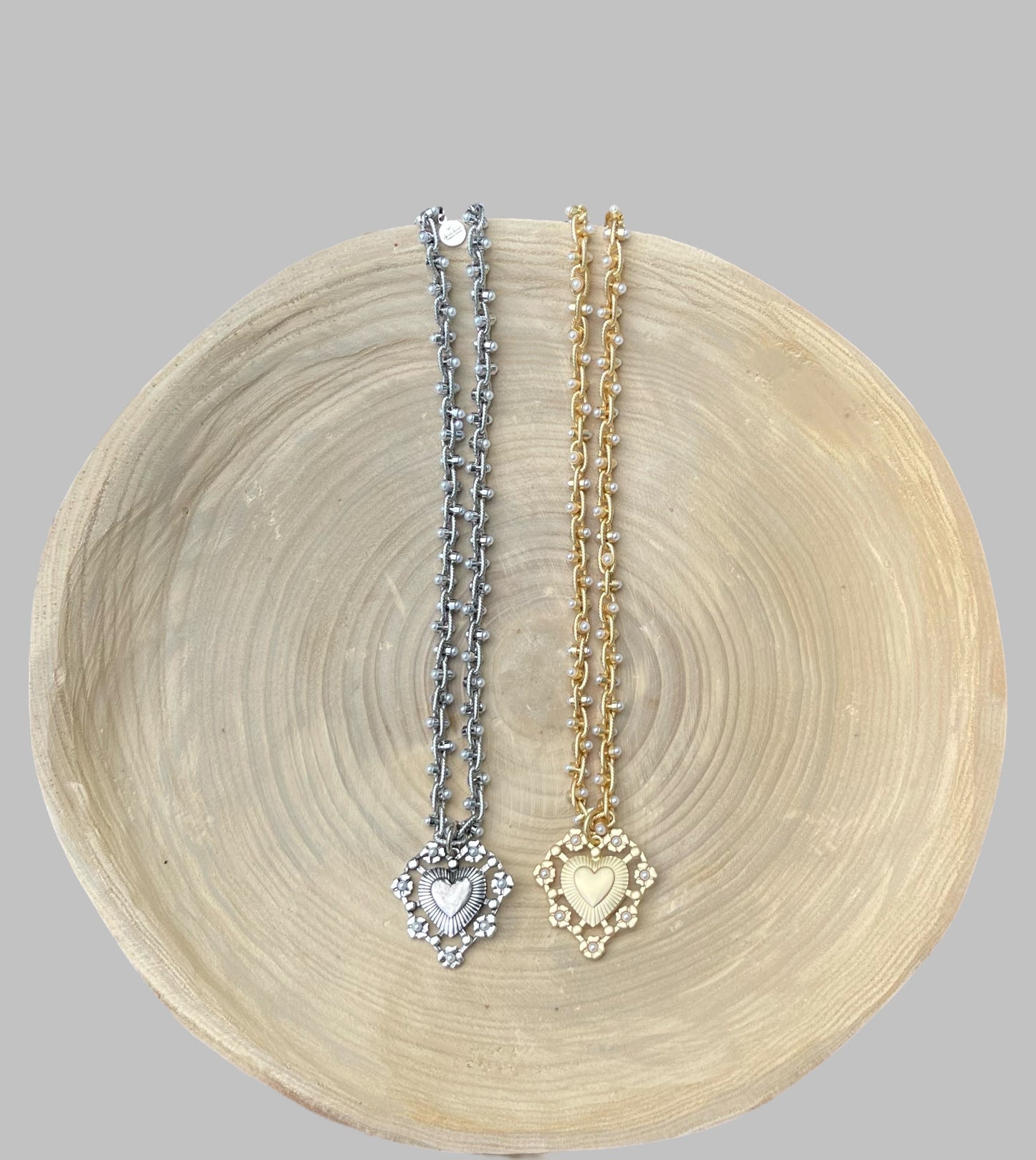 Bold Bijoux in Gold Necklace: Matte gold throughout Tiny pearls Statement heart