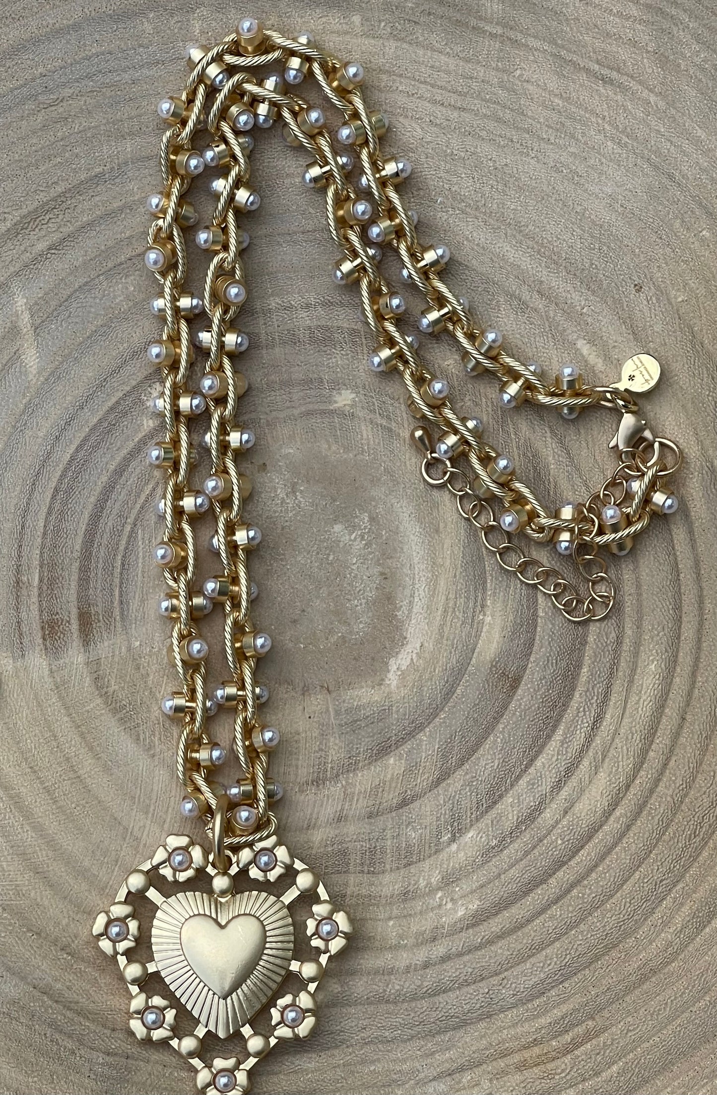 Bold Bijoux in Gold Necklace: Matte gold throughout Tiny pearls Statement heart