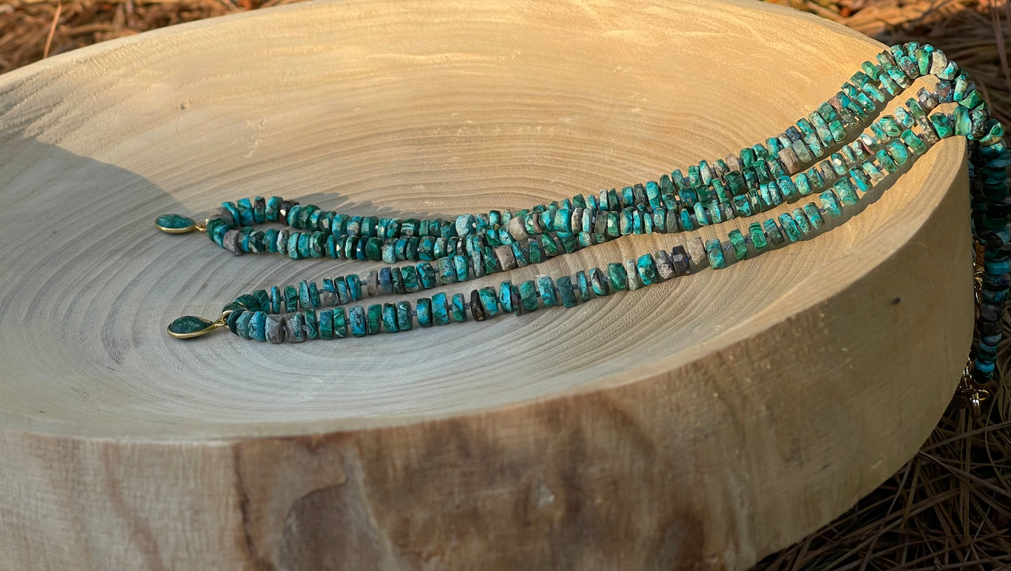 Tibetan Tides Necklace: Faceted Tibetan Turquoise Handknotted on silk with an Emerald teardrop pendant