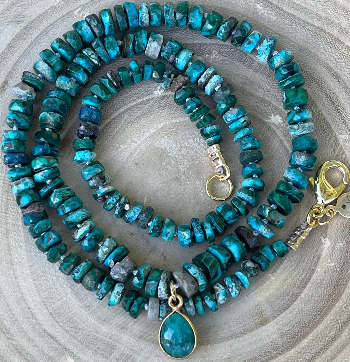 Tibetan Tides Necklace: Faceted Tibetan Turquoise Handknotted on silk with an Emerald teardrop pendant