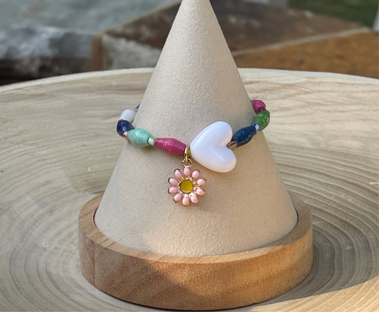 Kindred Colors Bracelet: Recycled paper bicone shaped beads, glass spacer beads, shiny white heart and flower charm