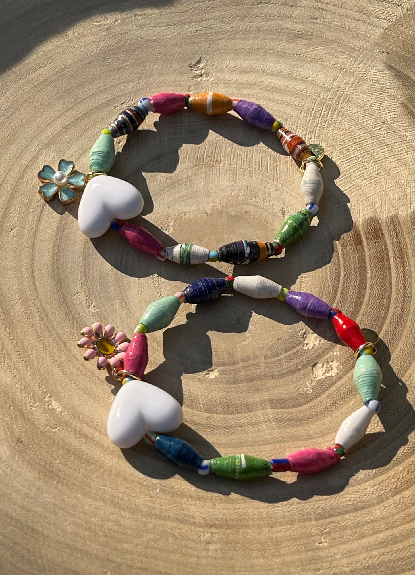 Kindred Colors Bracelet: Recycled paper bicone shaped beads, glass spacer beads, shiny white heart and flower charm
