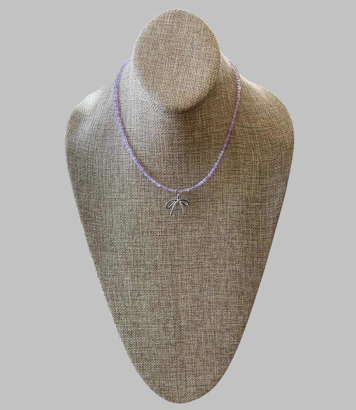 The Amethyst Skinny: Faceted Amethyst gemstones with a bow charm in Gold or Silver