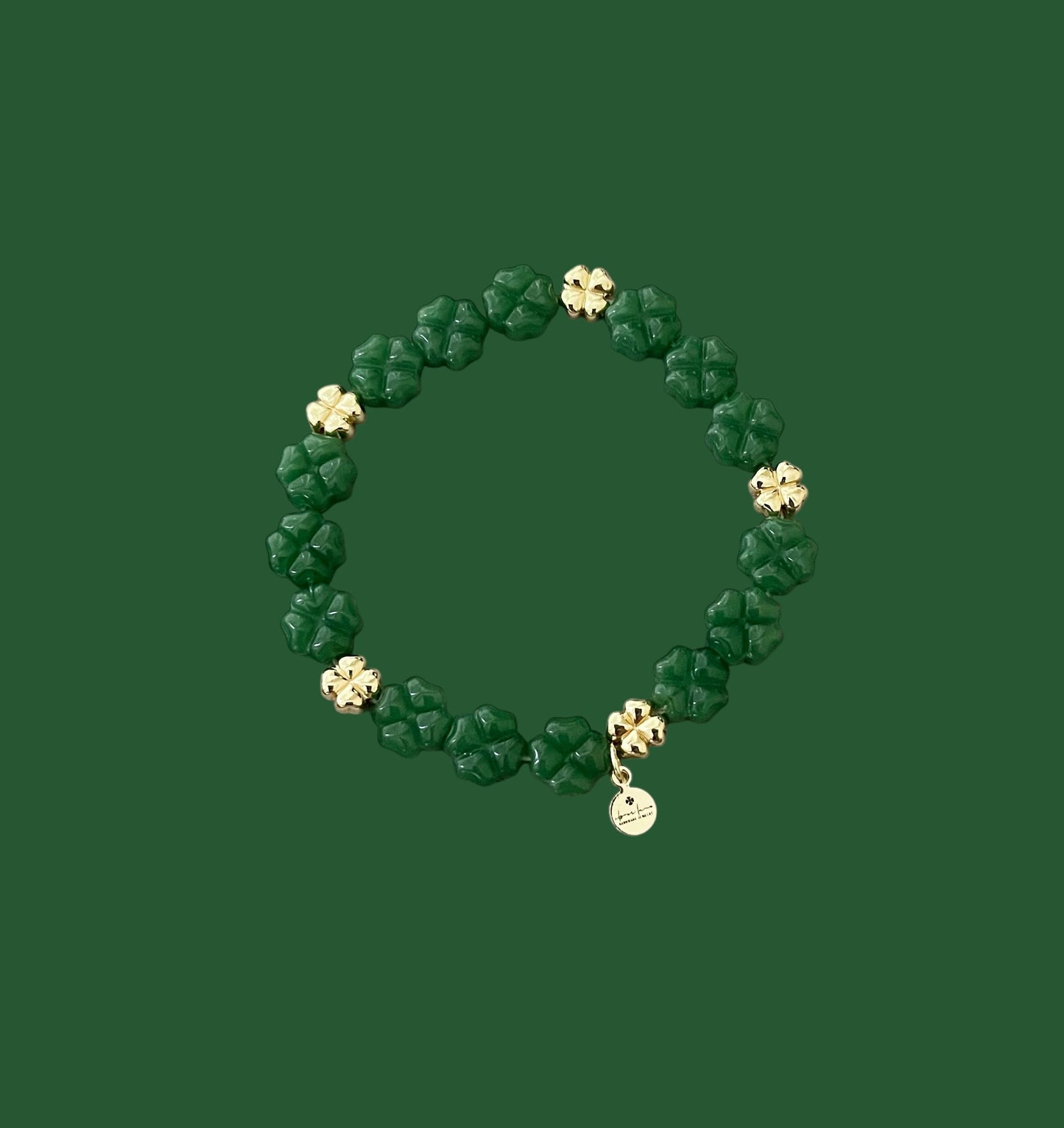 Green Glass and Gold Shamrock bracelet: A stretch bracelet made with glass carved beads and gold filled brass accent beads FREE SHIPPING!