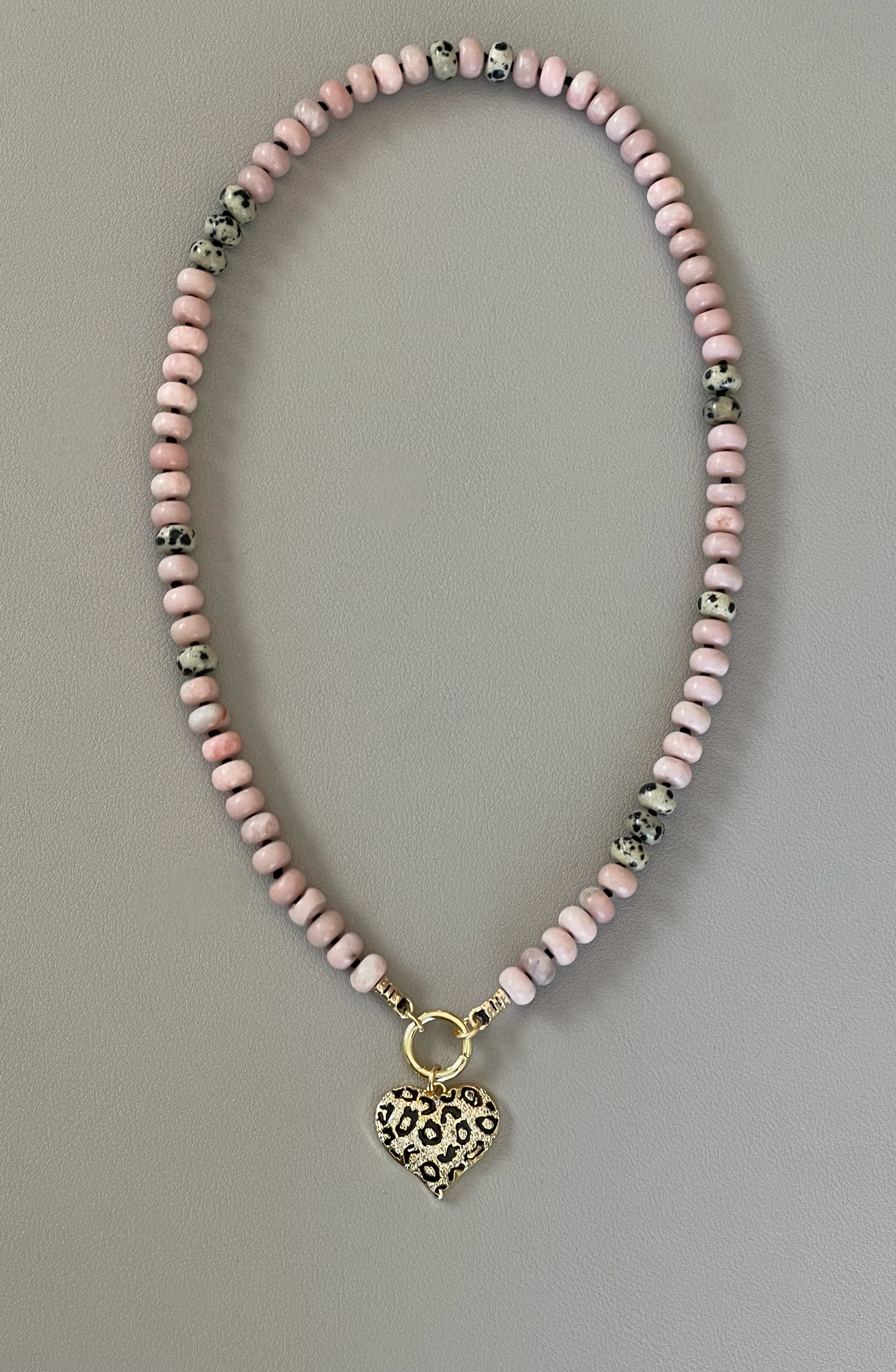 The Pink Leopard Necklace: Natural matte pink opals hand knotted on black silk w Dalmatian Jasper accents Gold pavé leopard heart OOAK