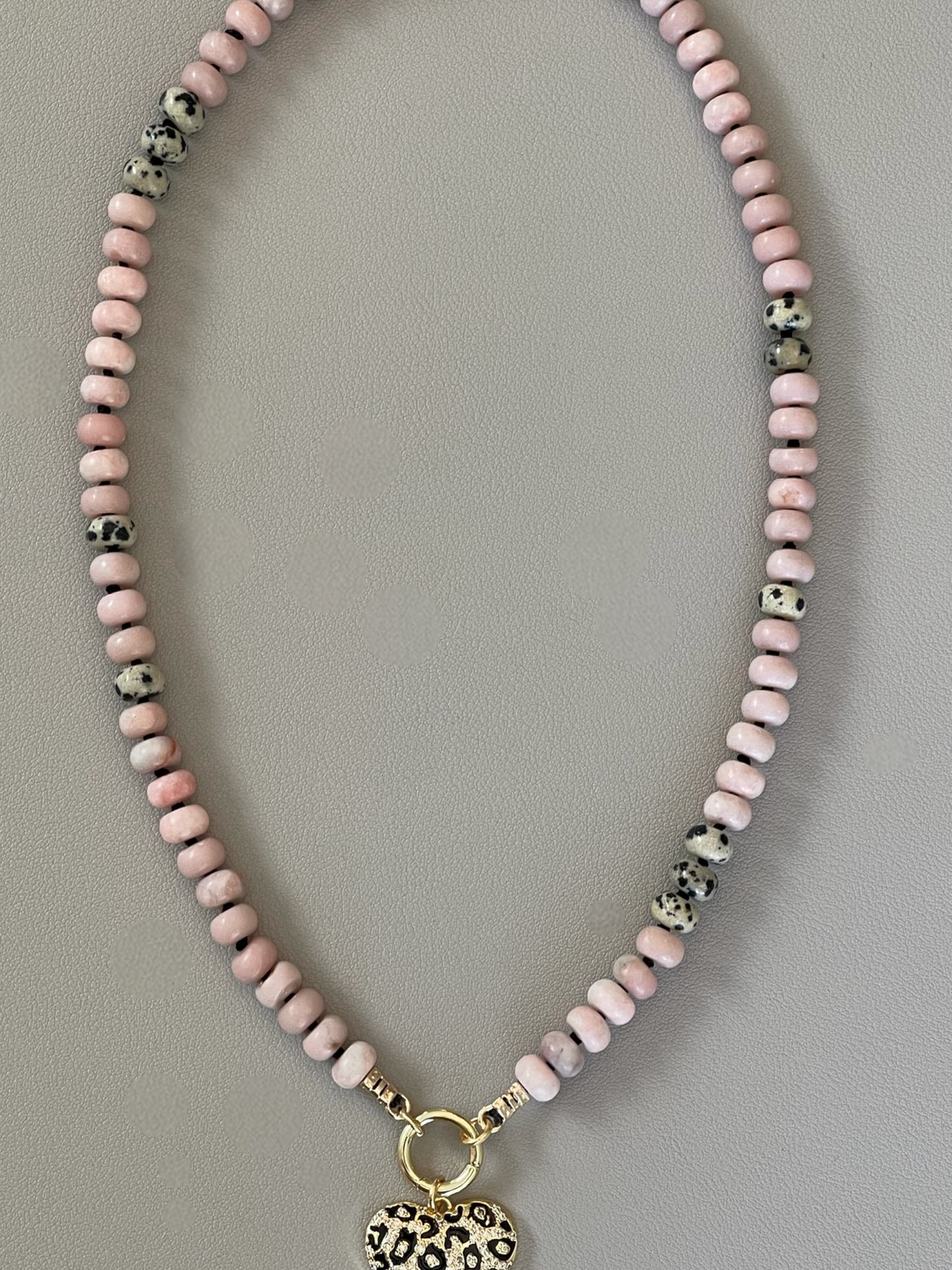 The Pink Leopard Necklace: Natural matte pink opals hand knotted on black silk w Dalmatian Jasper accents Gold pavé leopard heart OOAK