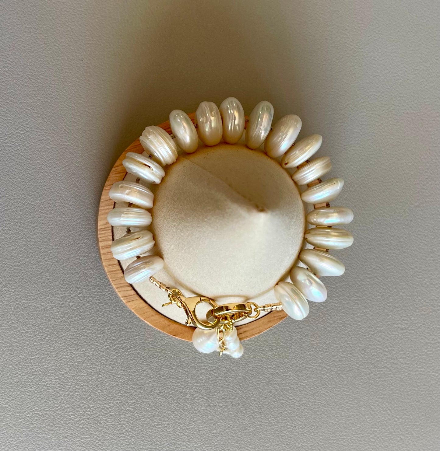 The Haven Bracelet: Coin shaped Pearls Hand-knotted on silk, Gold filled clasp/charm holder