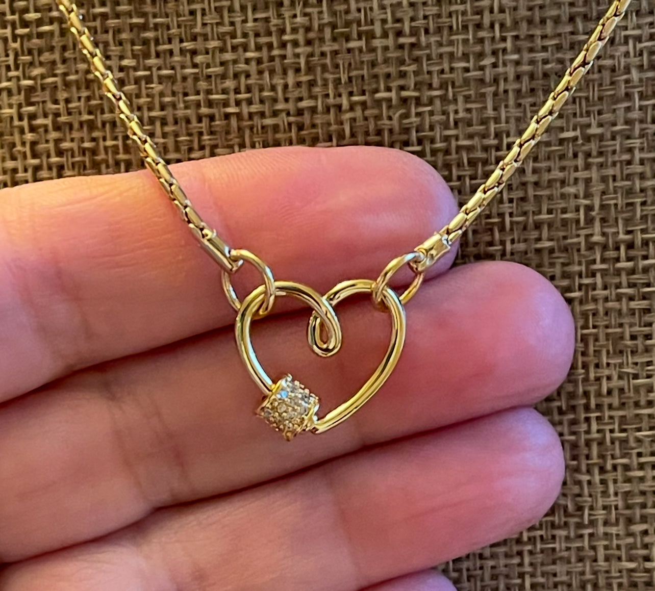 Be Still My Heart Necklace: A thin gold cable chain w/ an adorable heart that doubles as a clasp and a charm holder Pavé screw closure OOAK