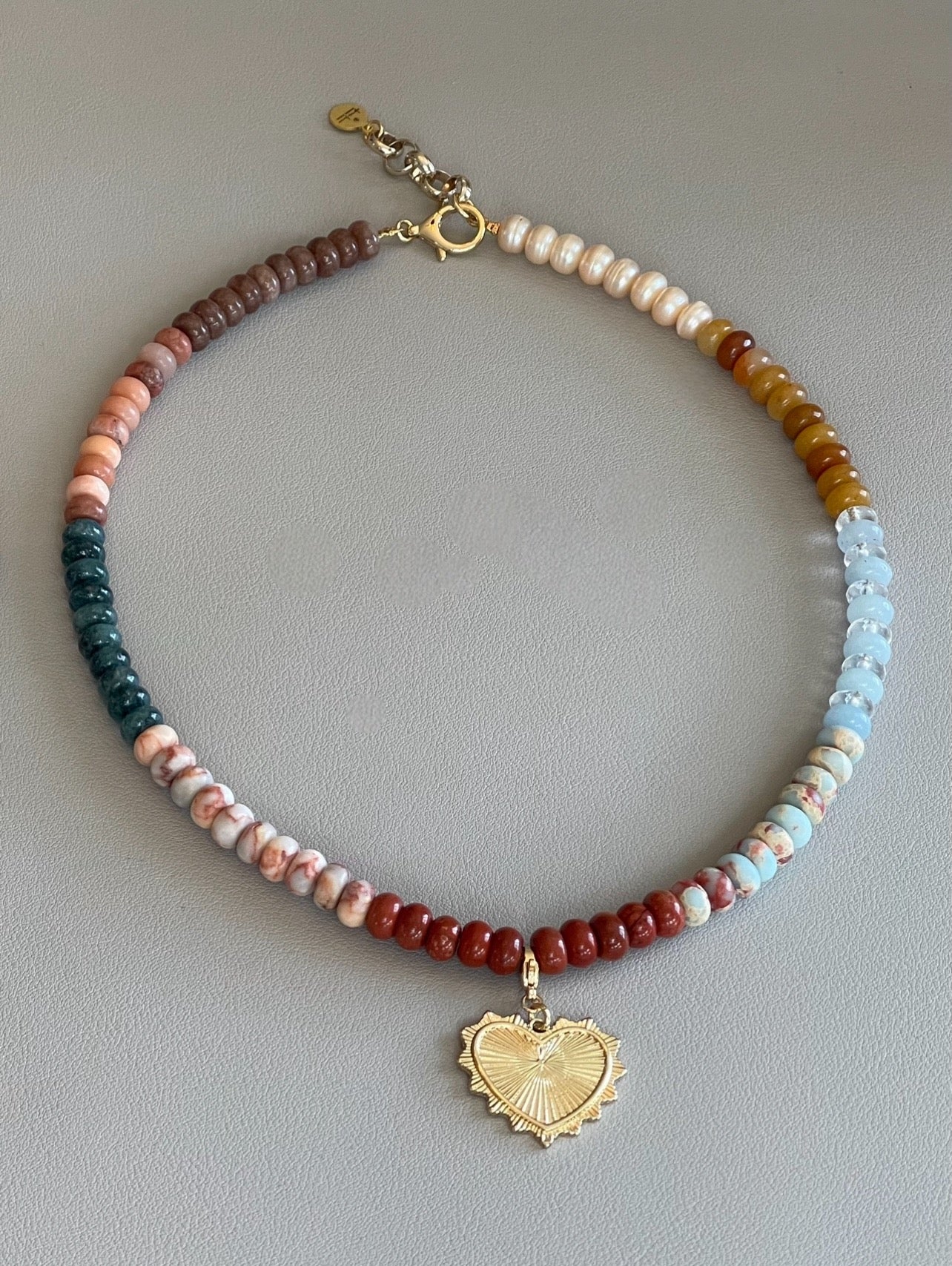 Earth & Sky Necklace: A blend of natural stones with a gold removable heart charm