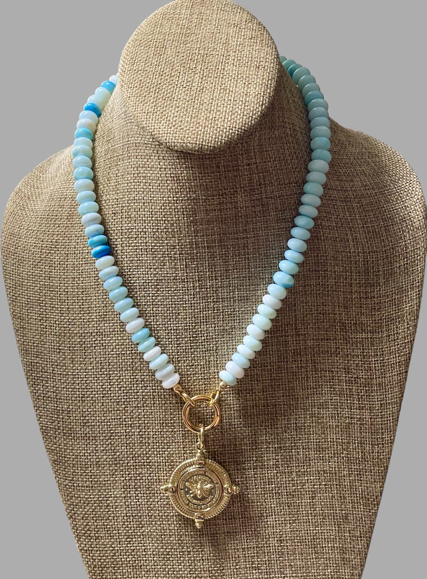 The Skylar Necklace: Sky Blue Opals with a Gold Circle Clasp and French Bee Coin Style Charm