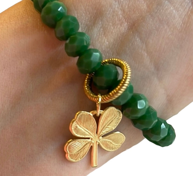 Lucky Charm Bracelet: Gorgeous tone of green in a faceted acrylic beaded stretch bracelet with a solid brass charm