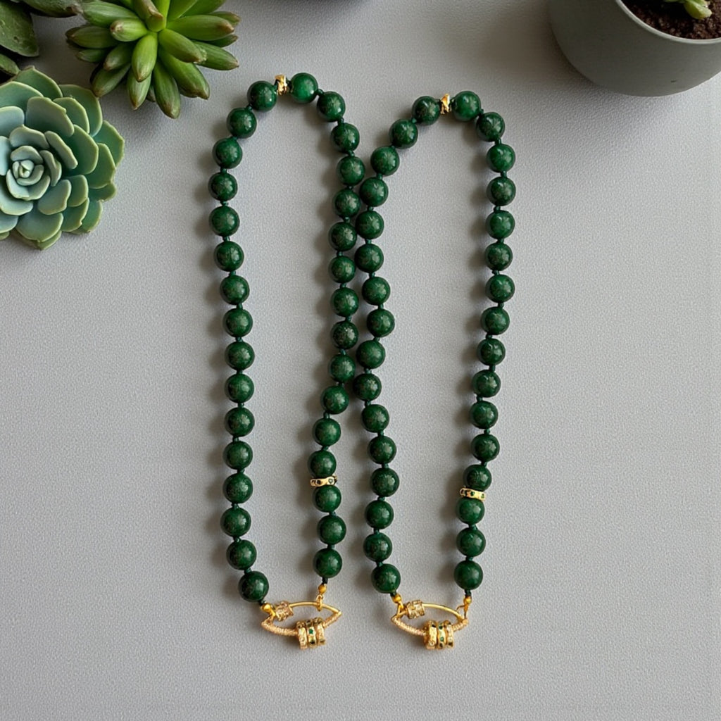 Vintage Vogue Necklace: Vintage Chinese Jade beads hand-knotted on matching satin cord•Gold pavé accents and charms