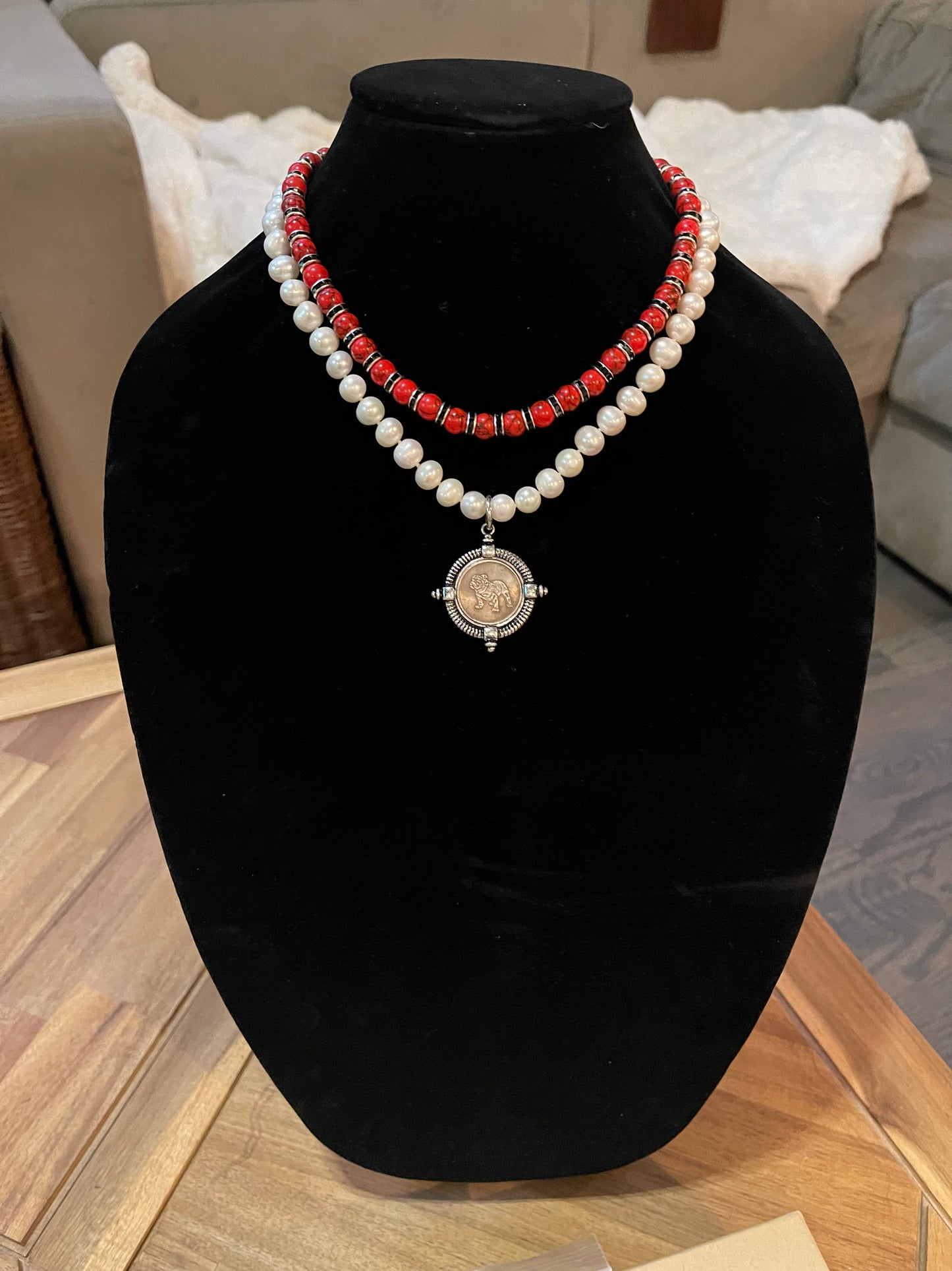 Go Dawgs Necklace: Hand-knotted Freshwater Pearls layered with Red & black marbled beads accented by black sparkling spacer beads and a chic coin-style Bulldog pendant Pinch clasp