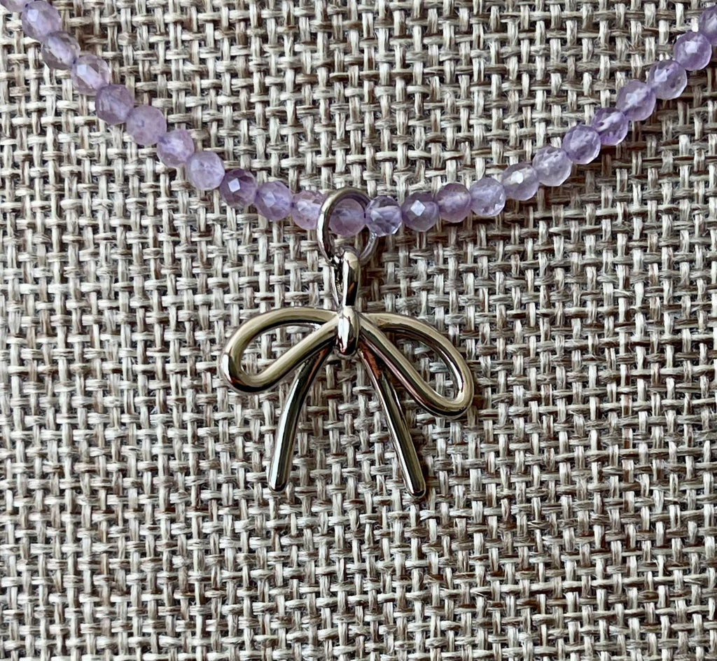 The Amethyst Skinny: Faceted Amethyst gemstones with a bow charm in Gold or Silver