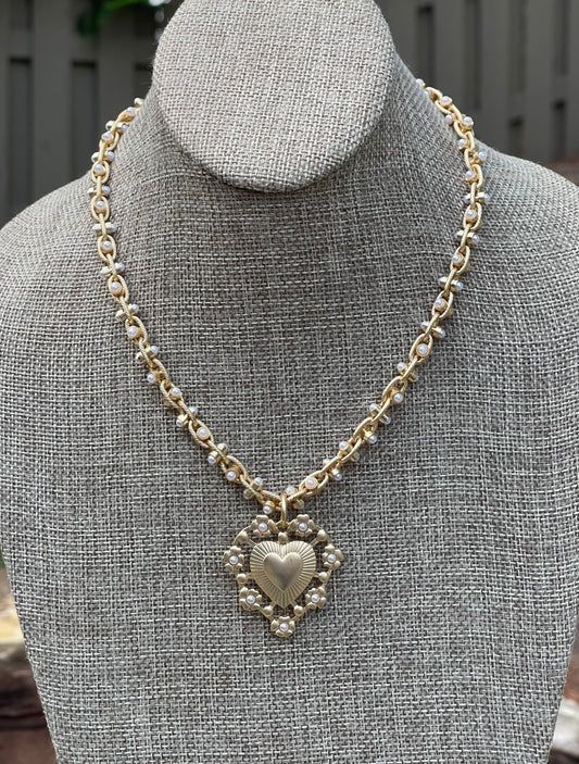Bold Bijoux in Gold Necklace: Matte gold throughout Tiny pearls Statement heart